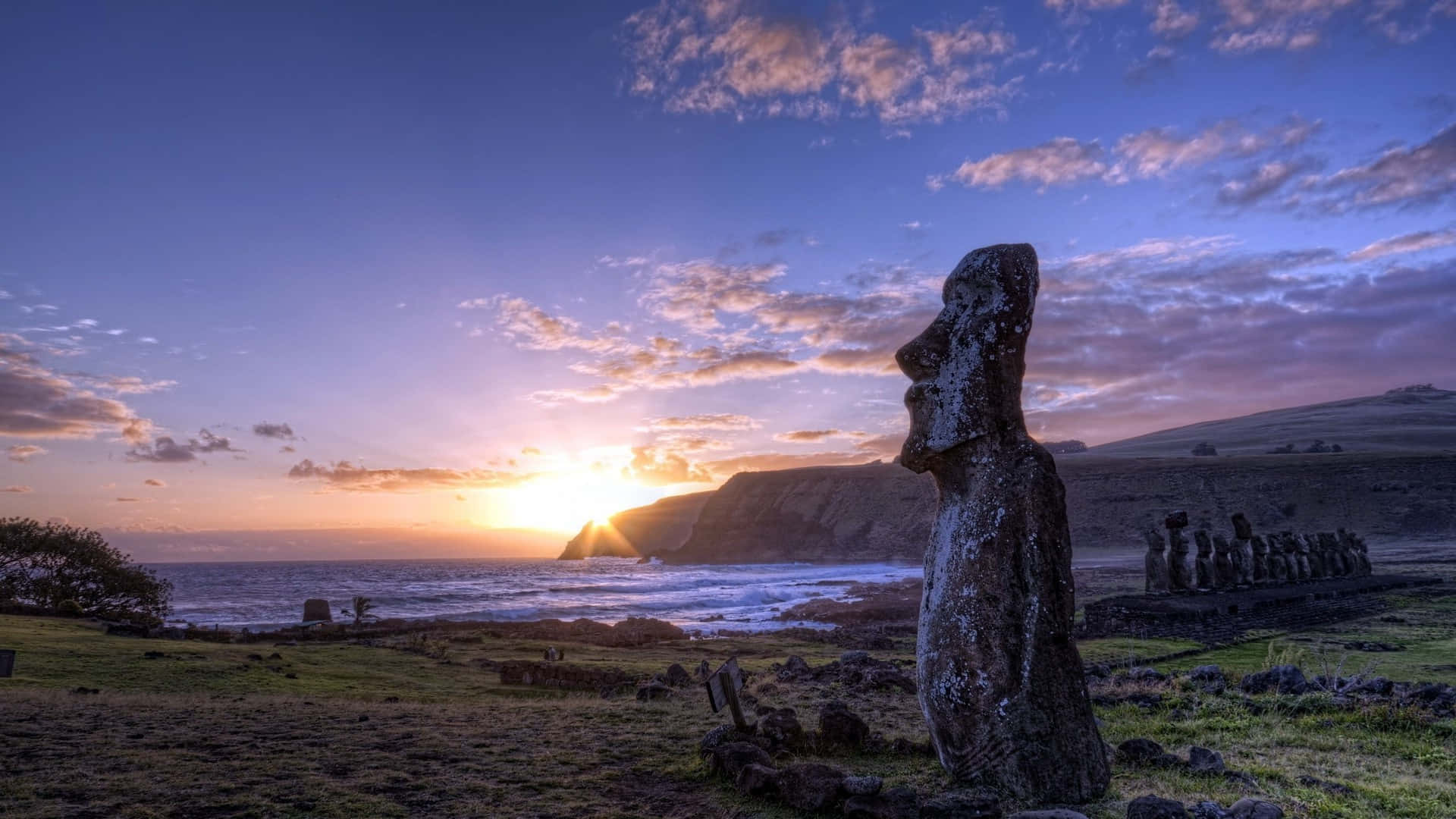 Moai Sculptures With View Of The Sea Background