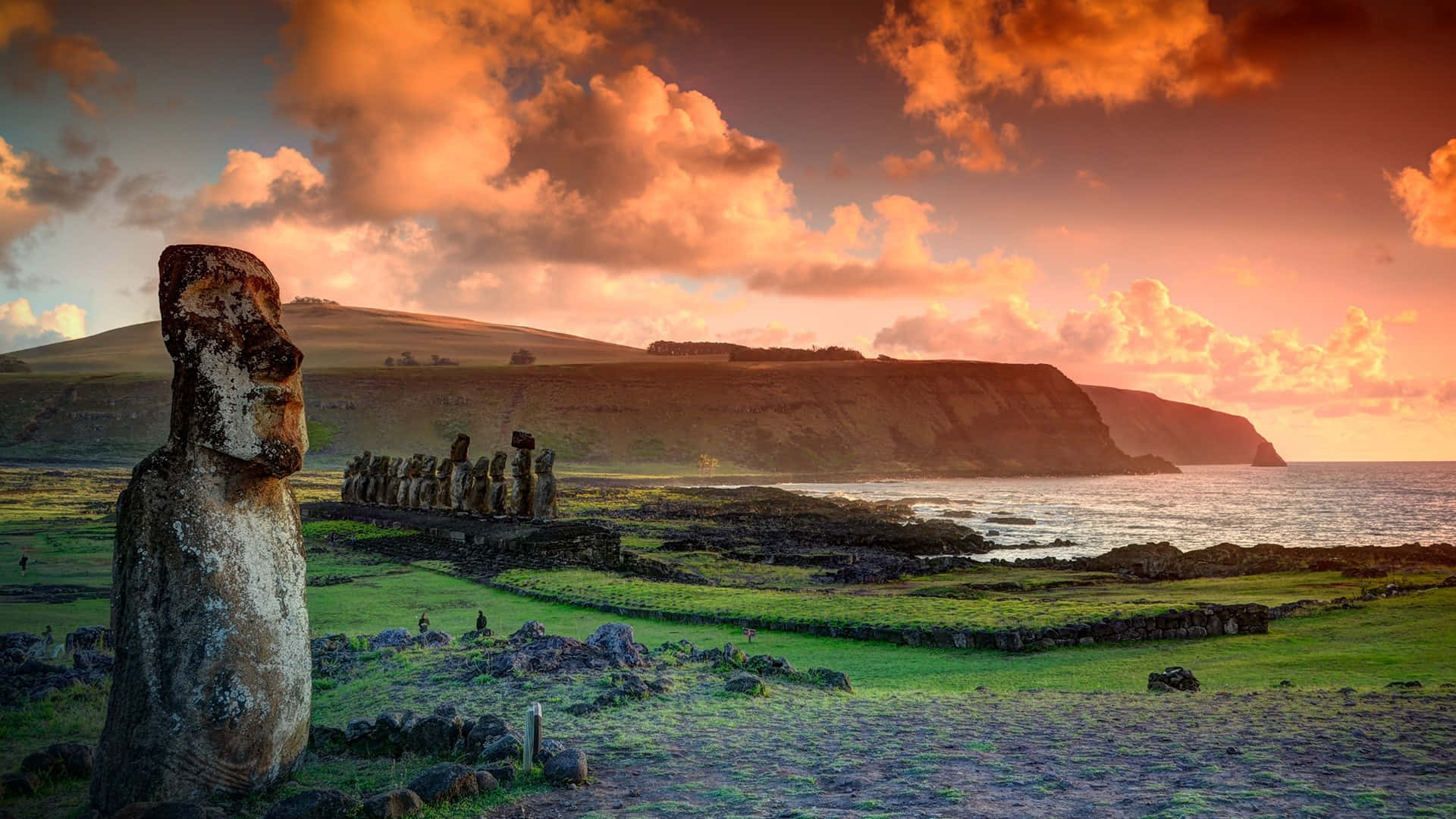Moai Scultptures With The Sunset Sky Background