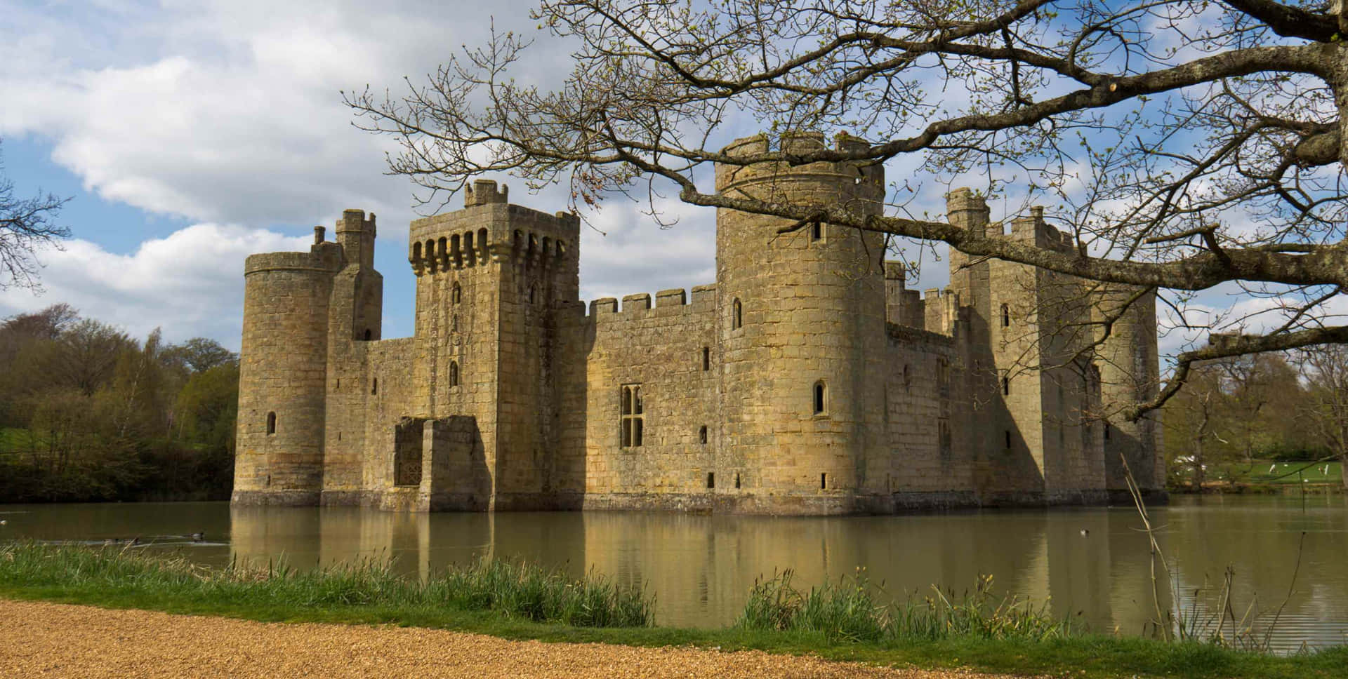 Moated Bodiam Castle In England With Dried Trees