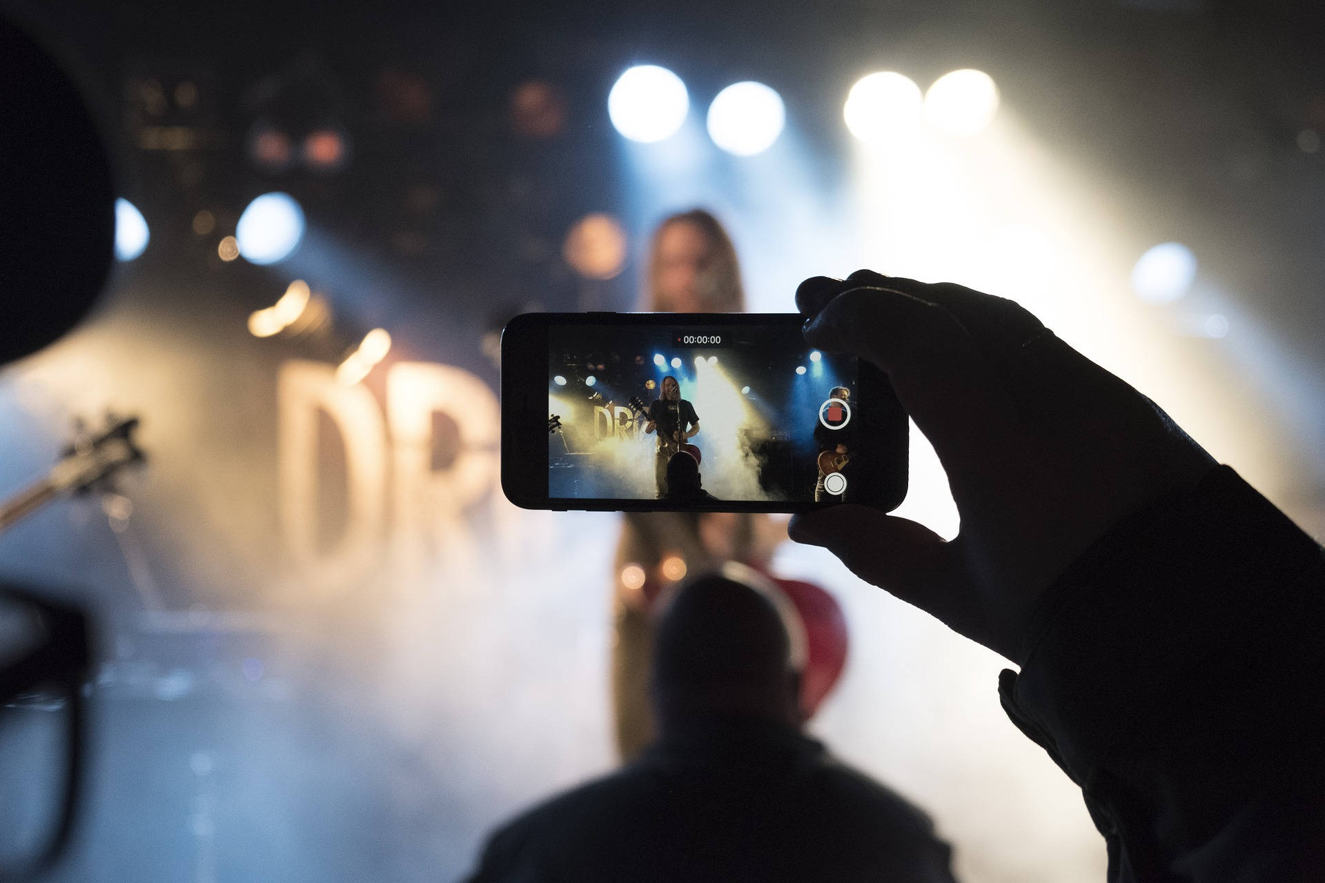 Mobile Phone In A Concert Background