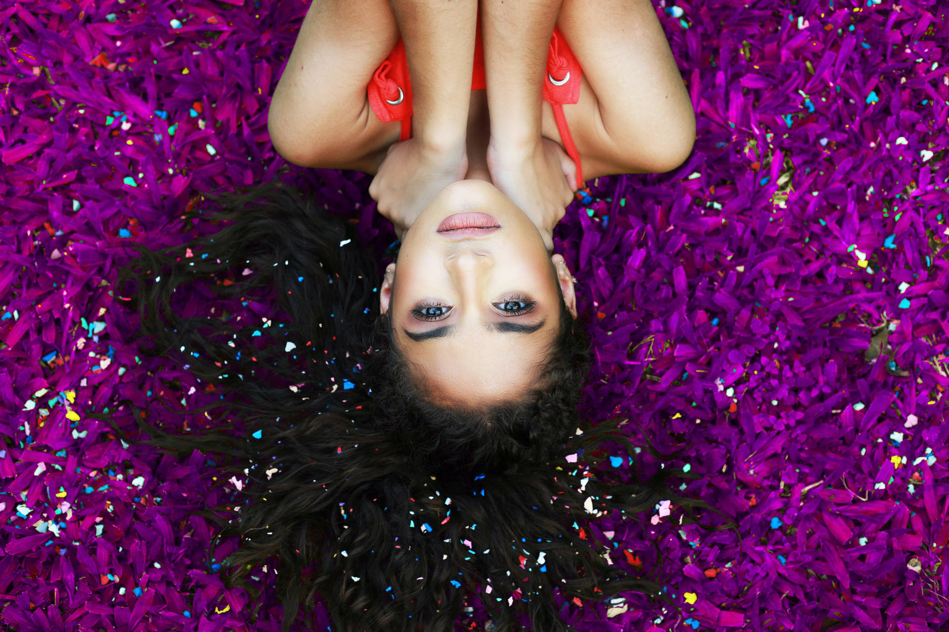Model On Purple Petals Background