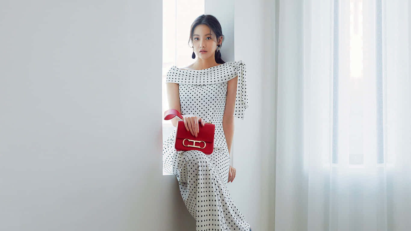 Model Wearing Modest Polka Dot Dress Background