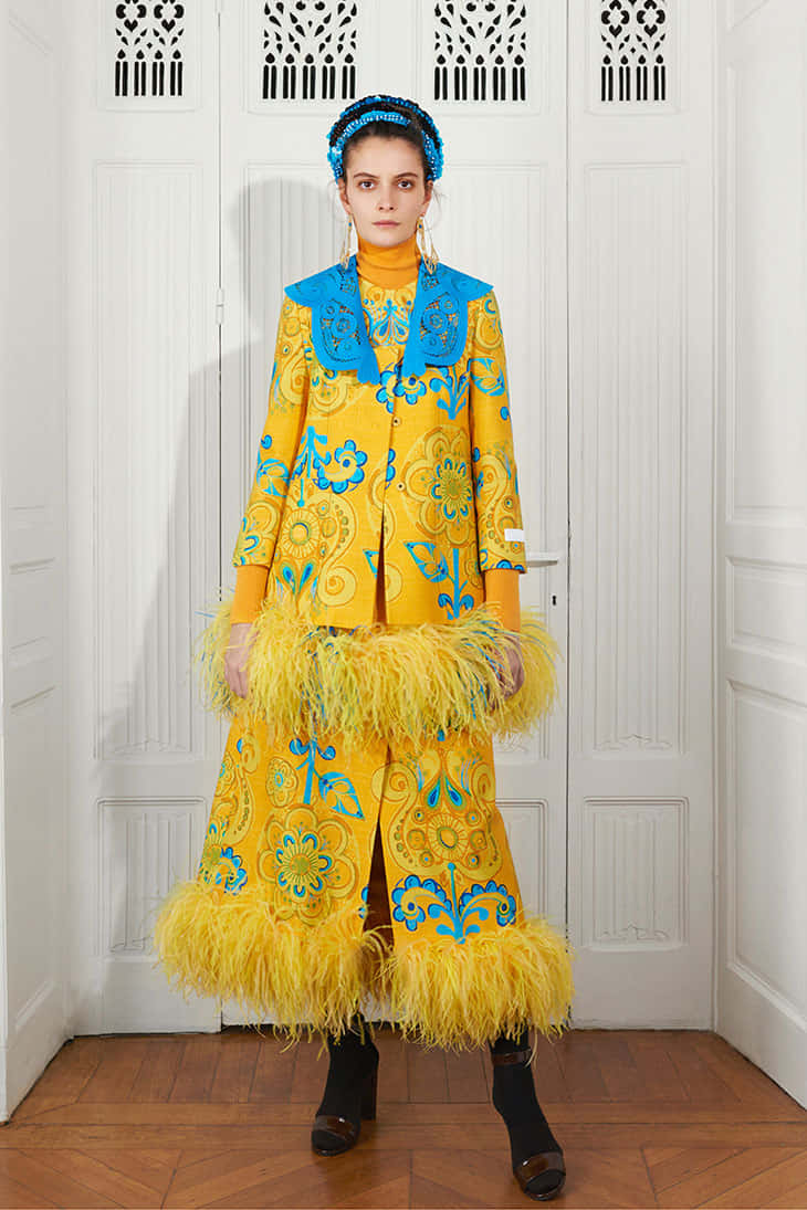 Model Wearing Yellow And Blue Patou Ensemble