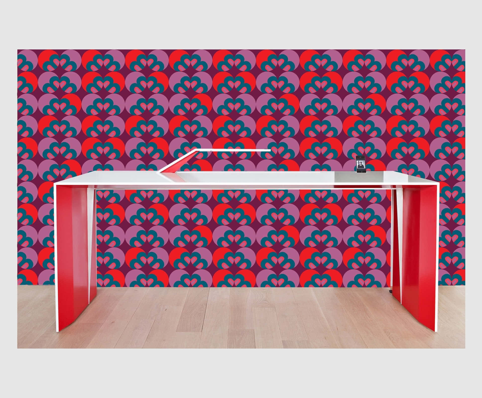Modern Desk Against Patterned Wallpaper