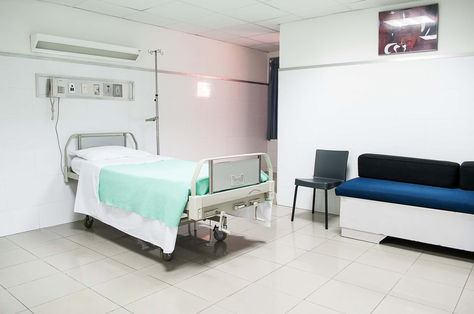 Modern Hospital Bed In A Well-lit, White Room Background