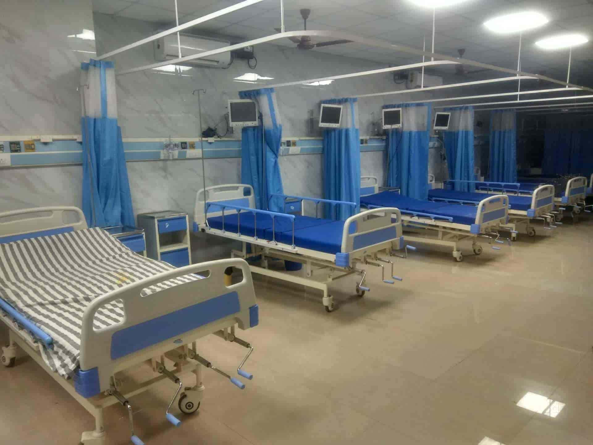 Modern Hospital Room Featuring A Fully Equipped Hospital Bed