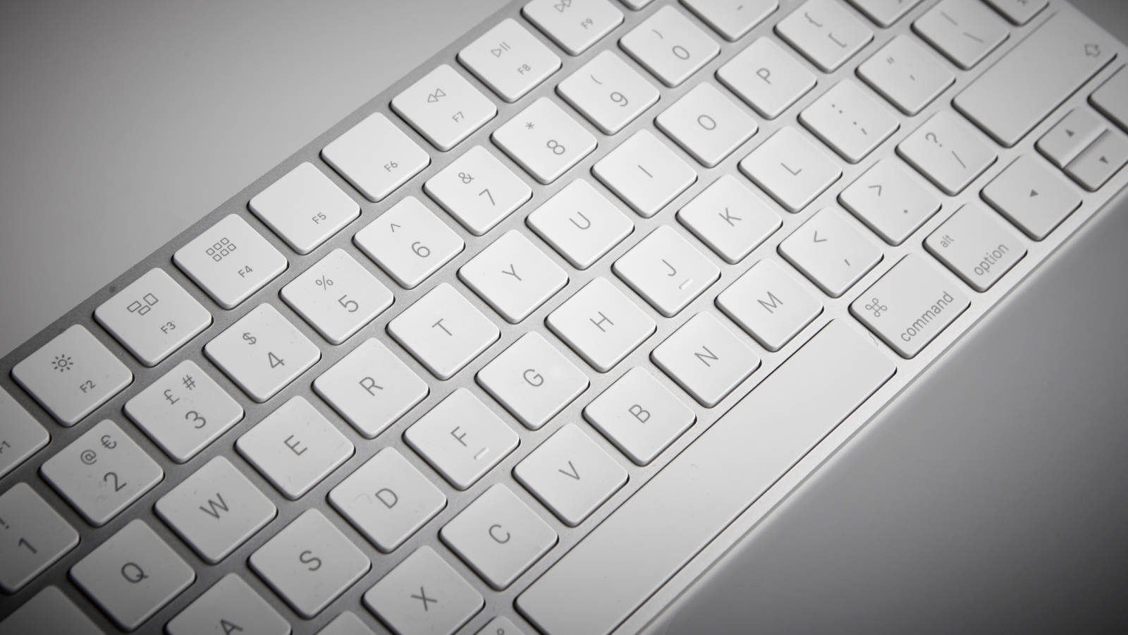 Modern Specifics Of A Technological Icon - Silver Mac Computer Keyboard Background