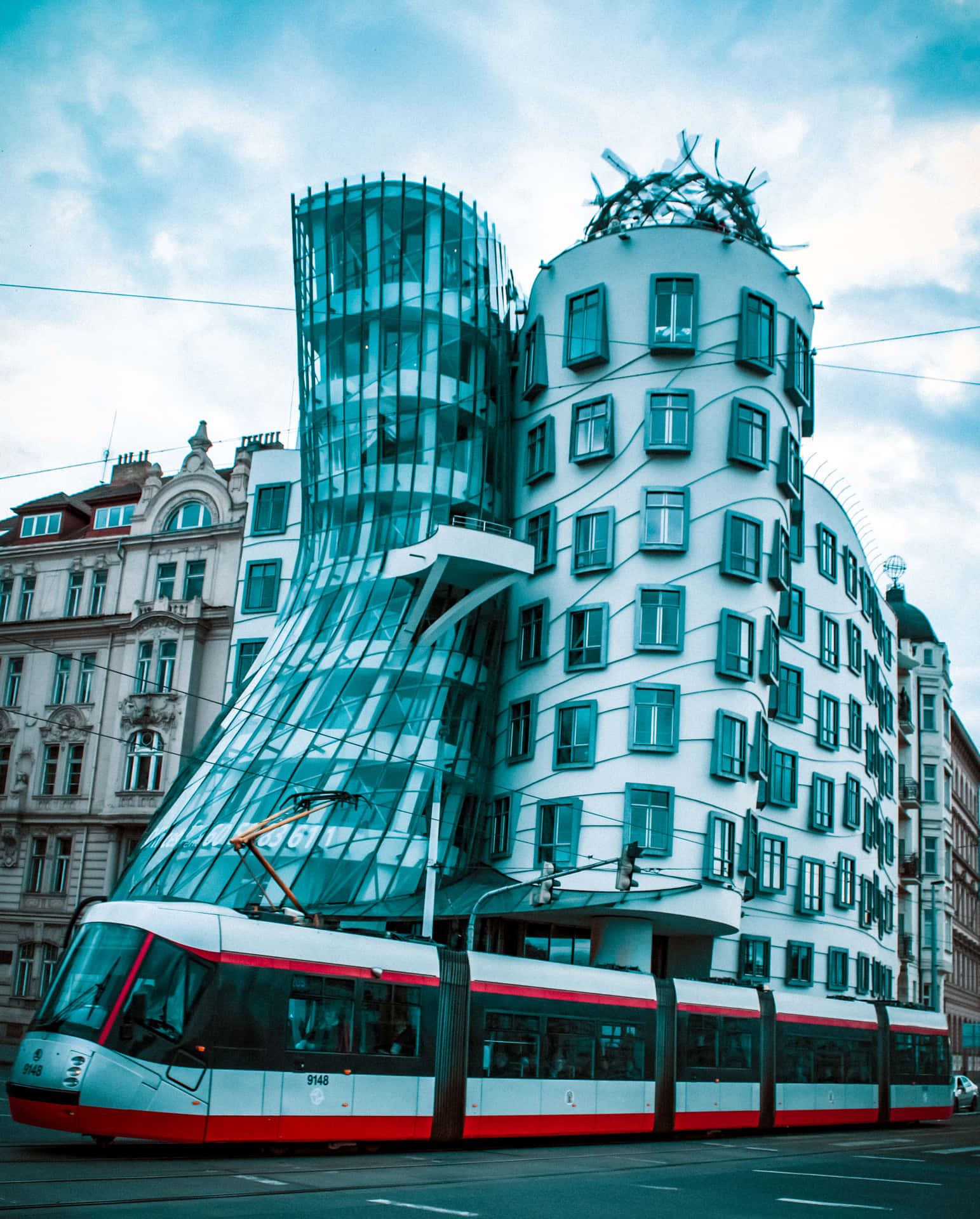 Modern Train Passing By Dancing House Background