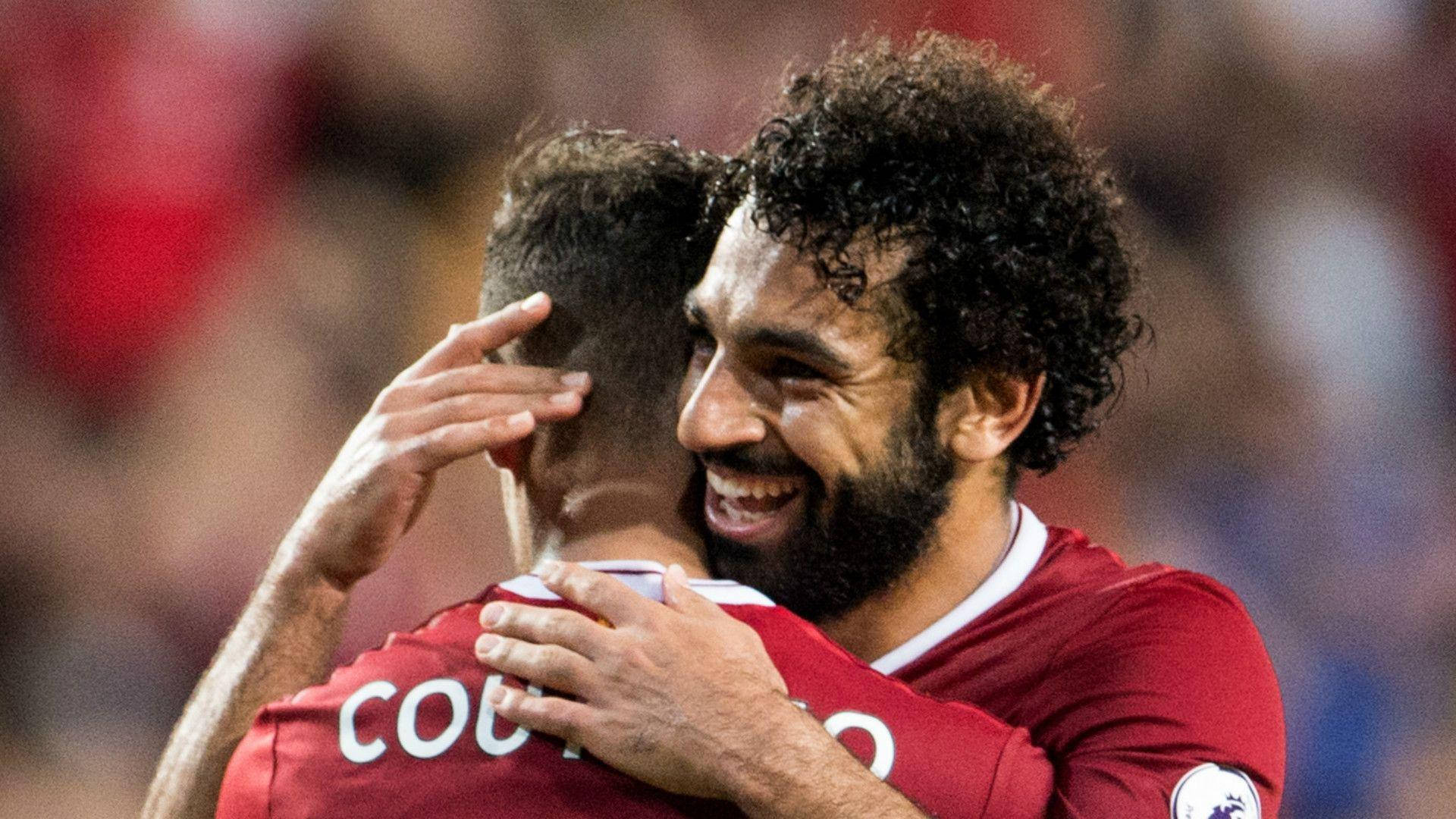 Mohamed Salah Hugging His Teammate Background