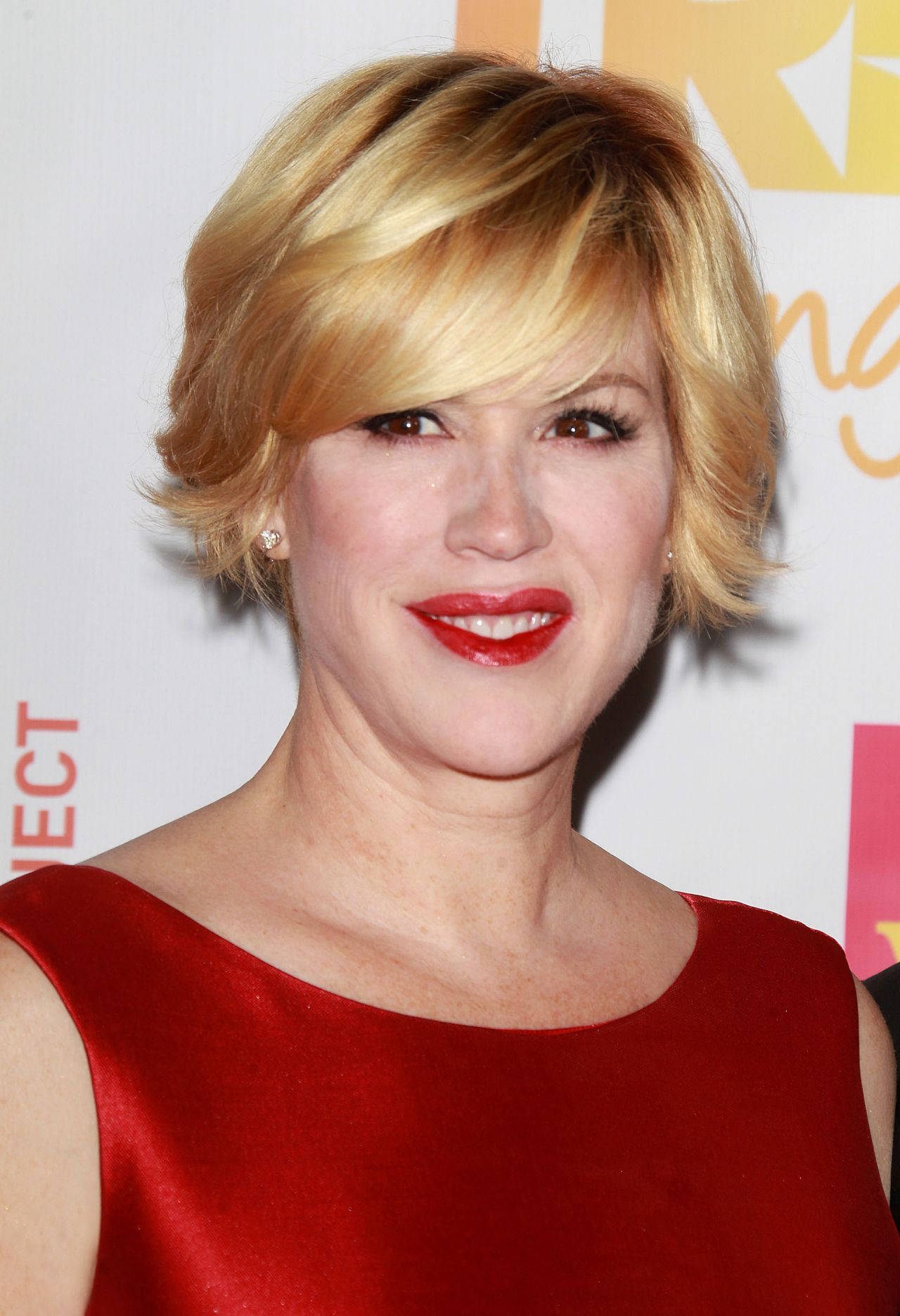 Molly Ringwald Rocking A Funky Hairstyle Background