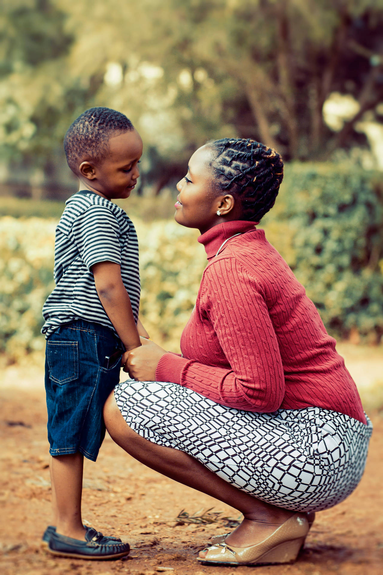 Mom And Son Facing Each Other Background