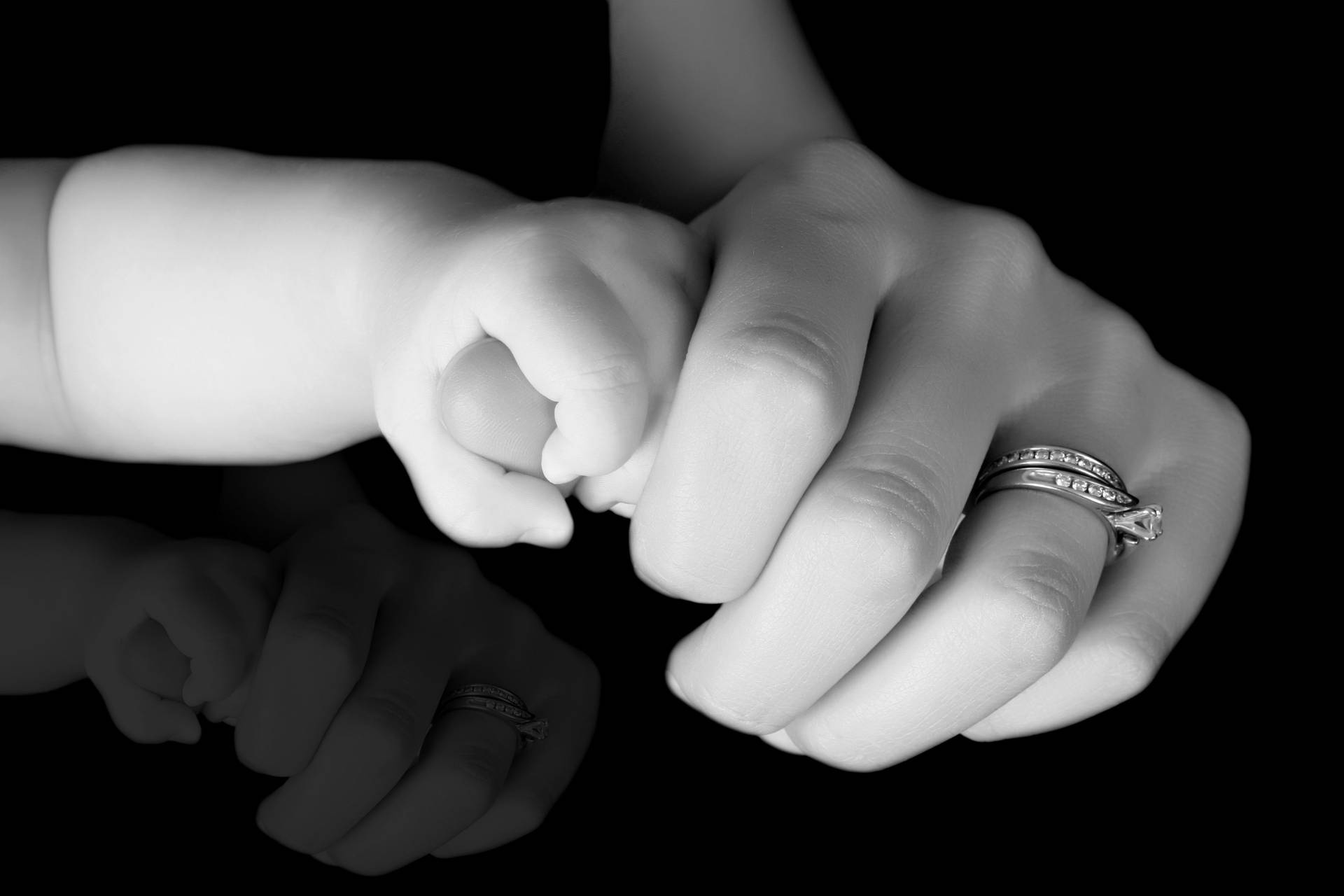 Mom And Son Holding Fingers Background