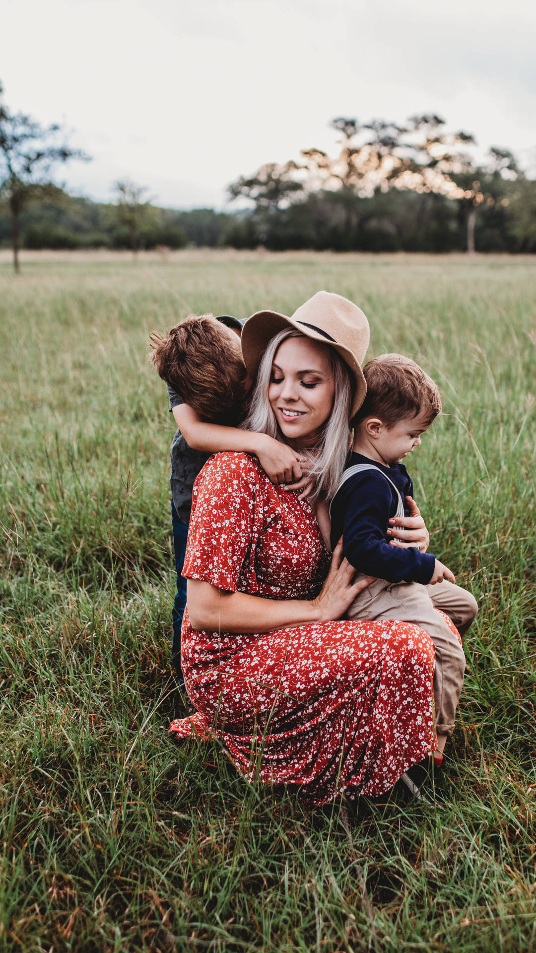 Mom And Son Hugging In Fields Background