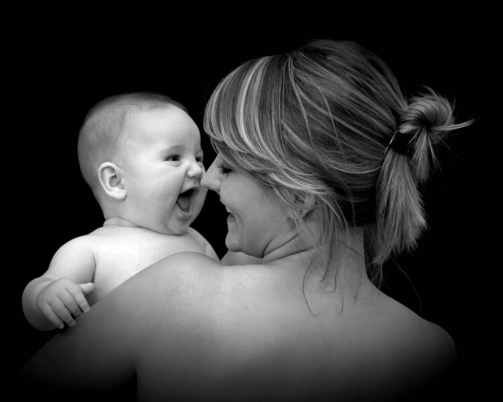 Mom And Son Laughing Black And White Background