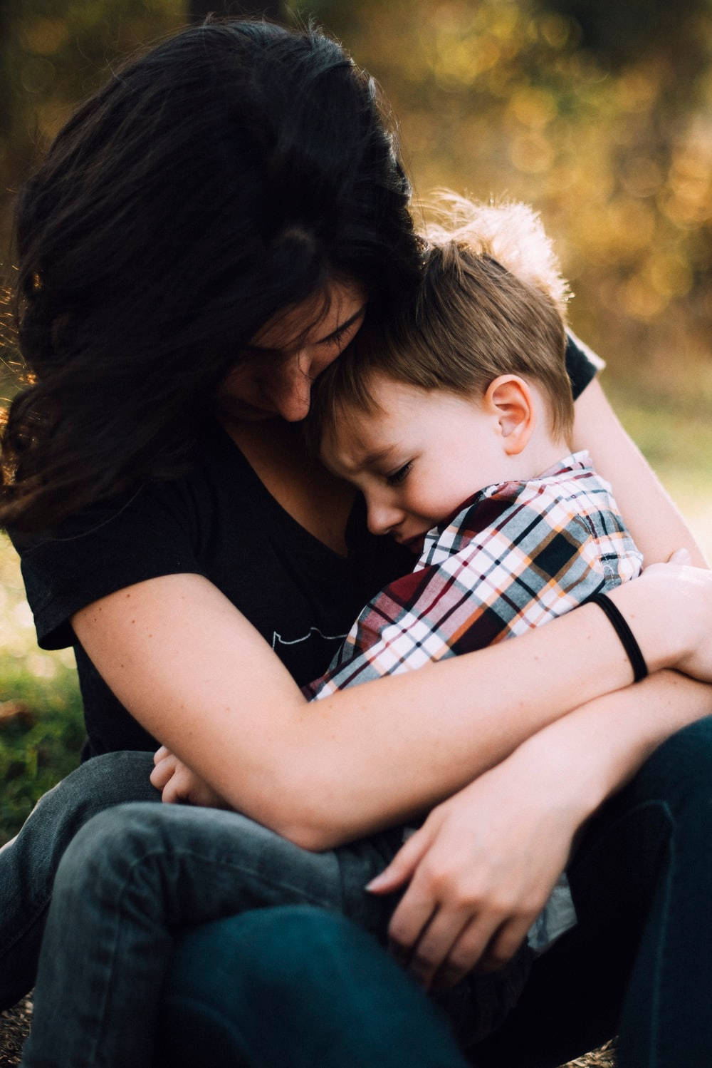 Mom And Son Sitting On Lap Background