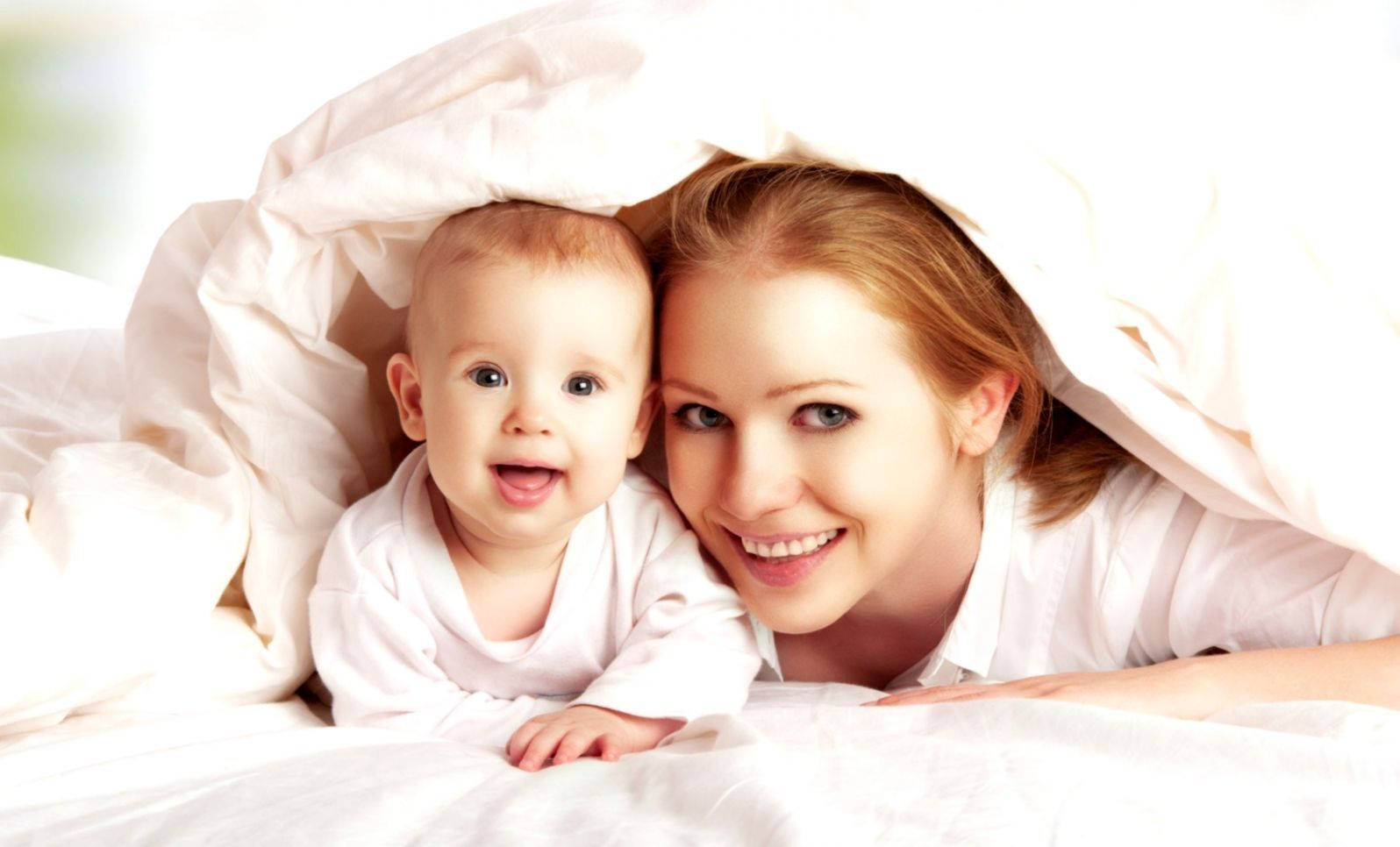 Mom And Son Under Blanket Background