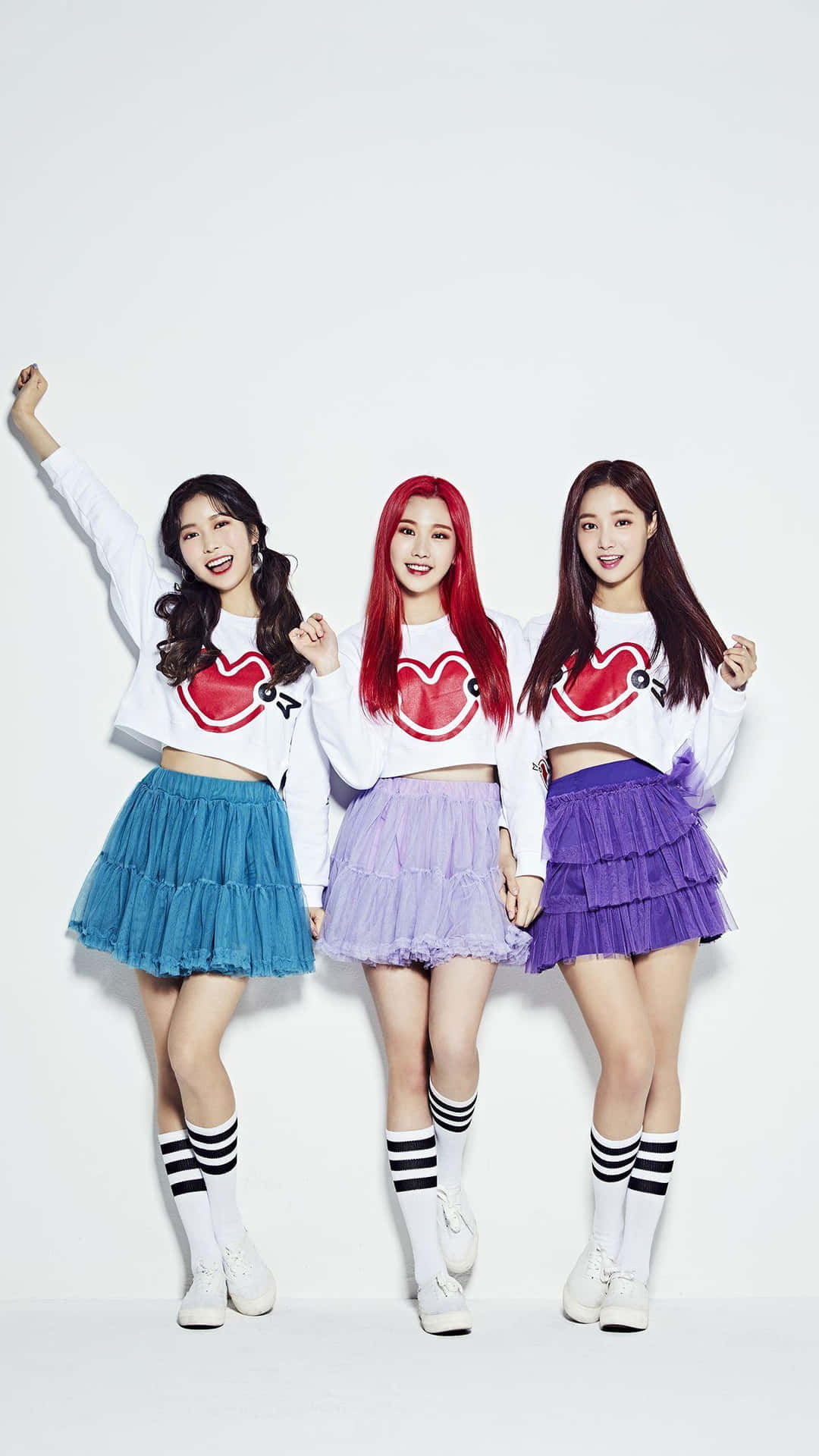 Momoland Members Posingin Colorful Outfits Background
