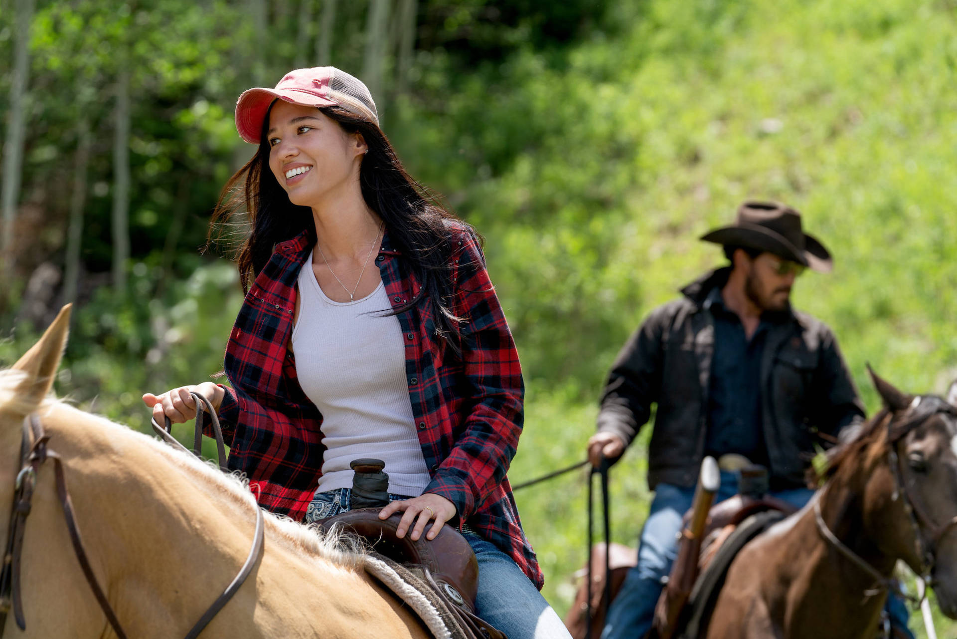 Monica And Rip Engaged In A Dramatic Scene In Yellowstone Tv Show Background