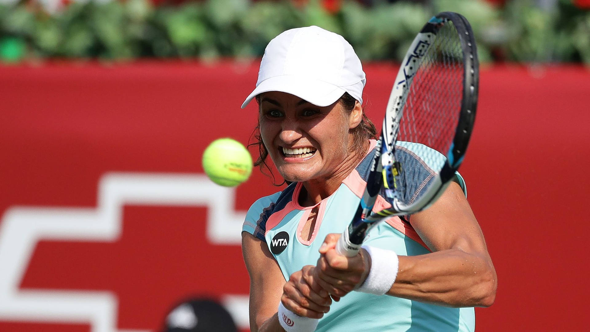 Monica Niculescu Exhibiting Perfect Tennis Swing Background