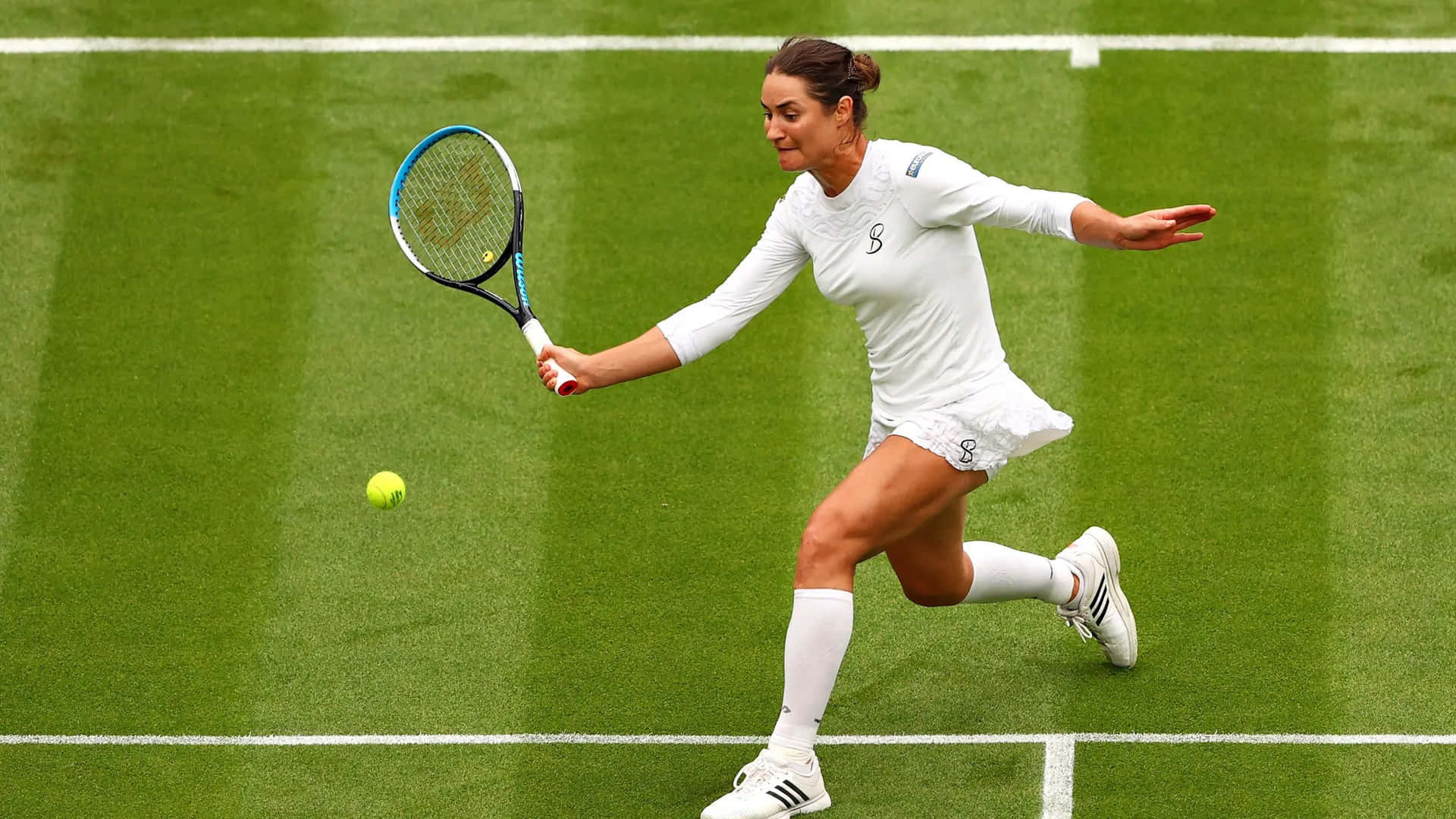 Monica Niculescu In Action, Wearing A White Tennis Outfit. Background