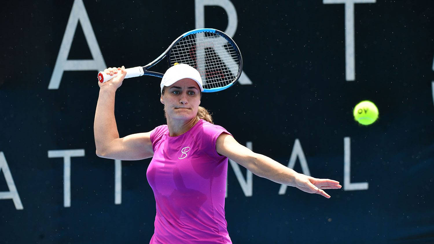 Monica Niculescu In Action With Her Tennis Racket Background