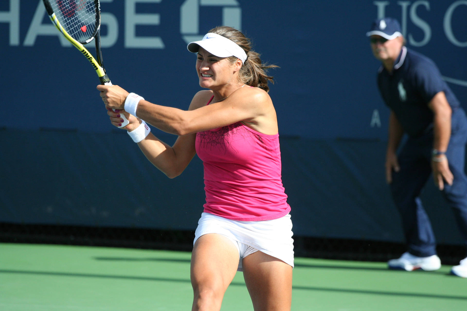 Monica Niculescu Swinging Her Racket Background