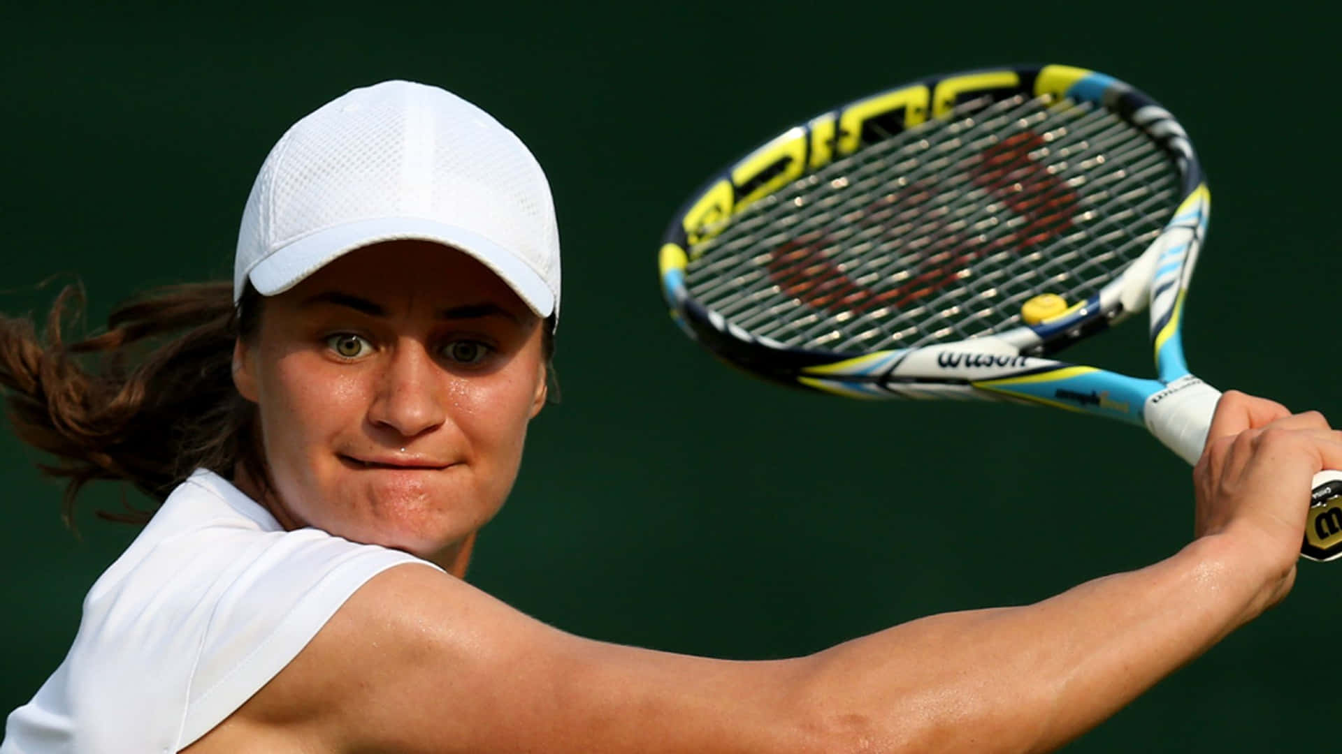 Monica Niculescu Swinging Racket Up-close Background