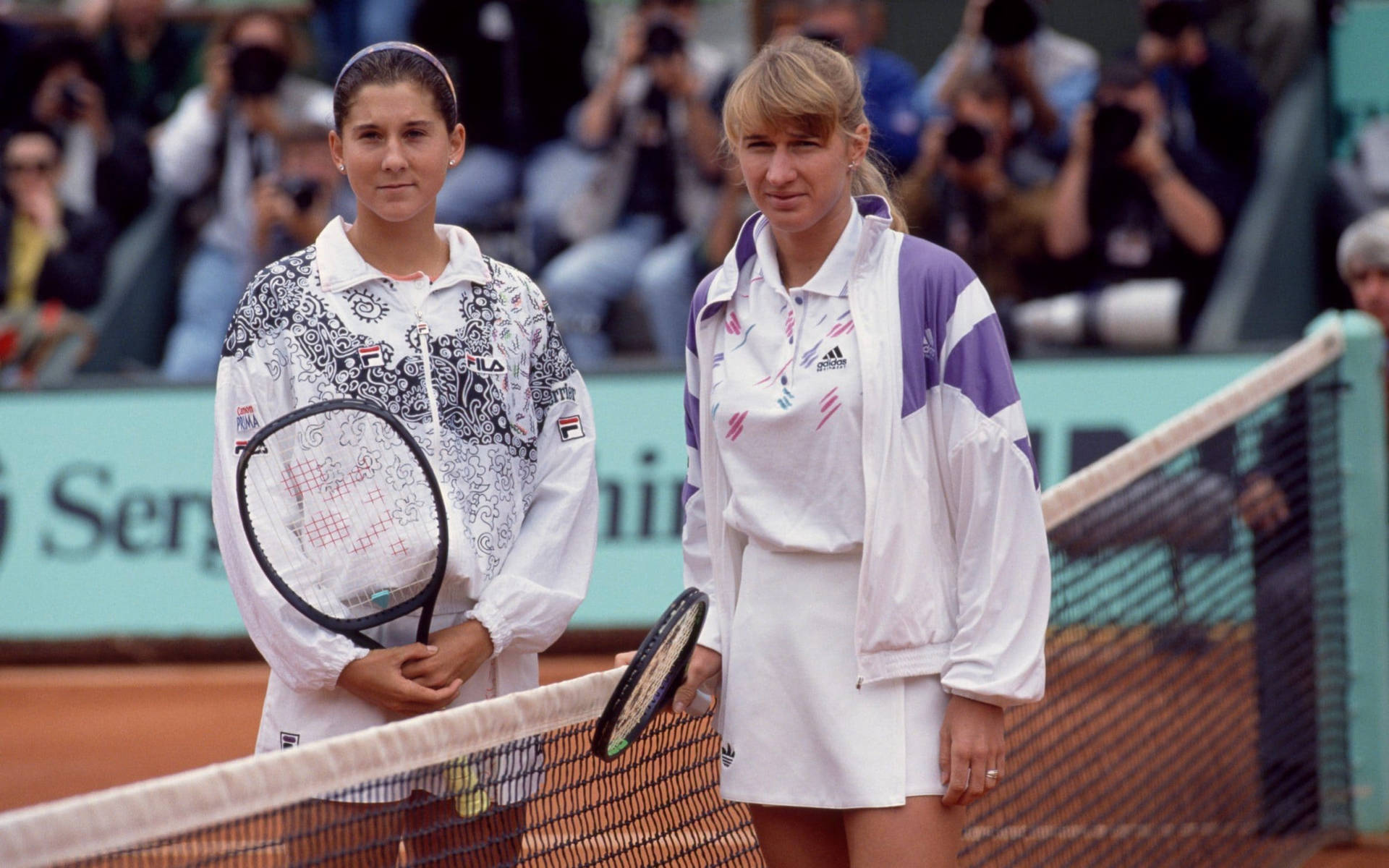 'monica Seles And Steffi Graf During A Vintage Tennis Match' Background