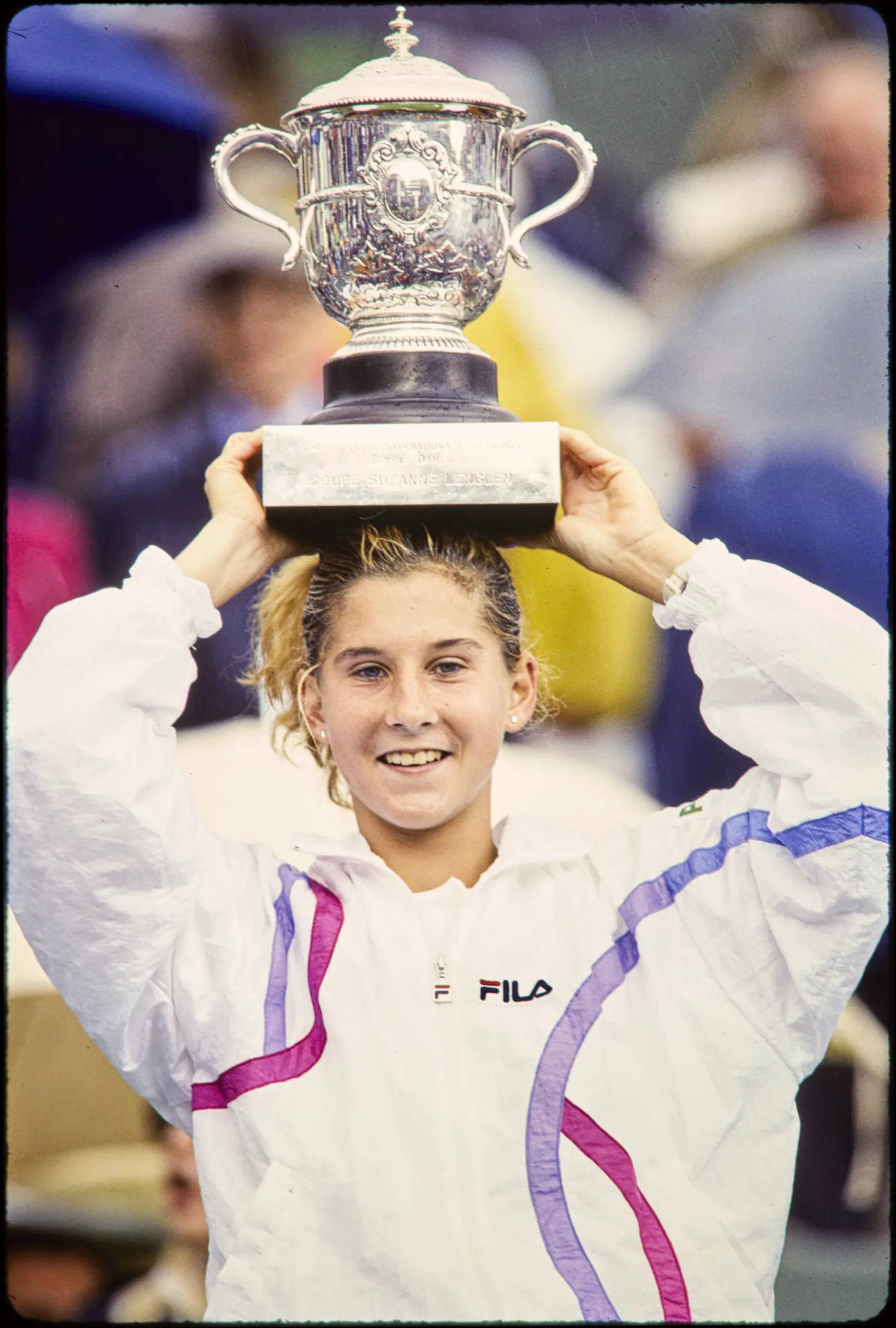 Monica Seles Holding Her Trophy Background