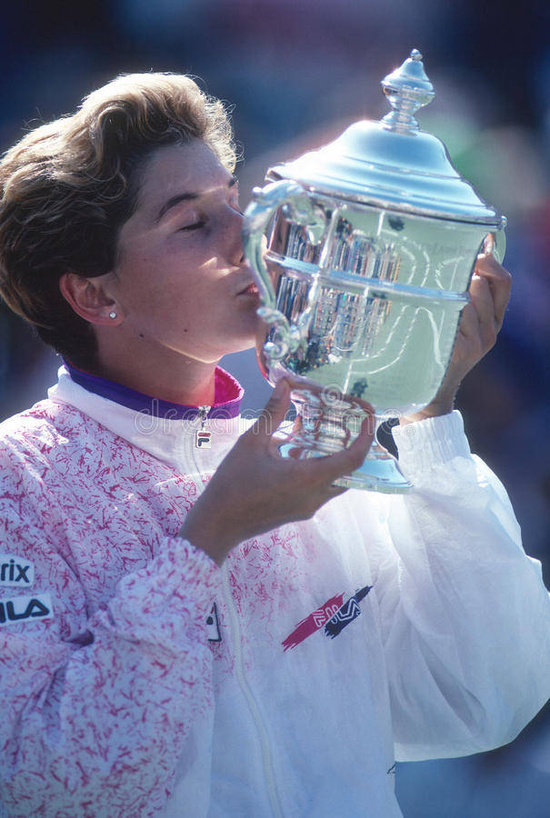 Monica Seles Kissing Her Trophy Background