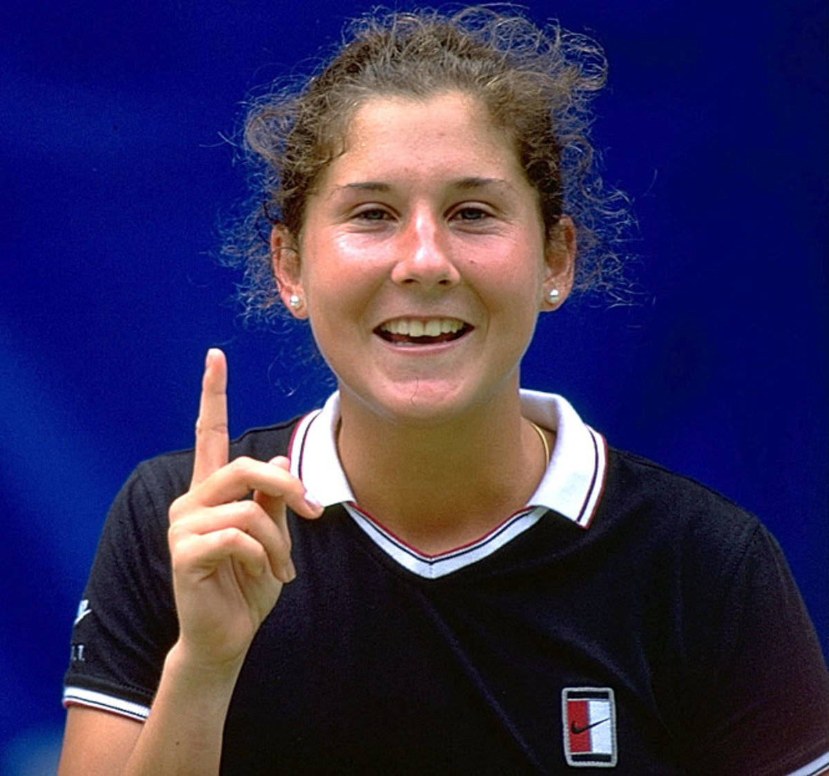 Monica Seles Pointing Background