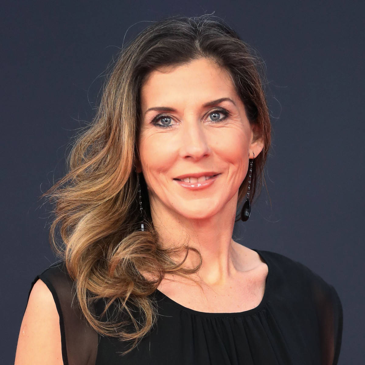 Monica Seles Wearing A Black Dress Background