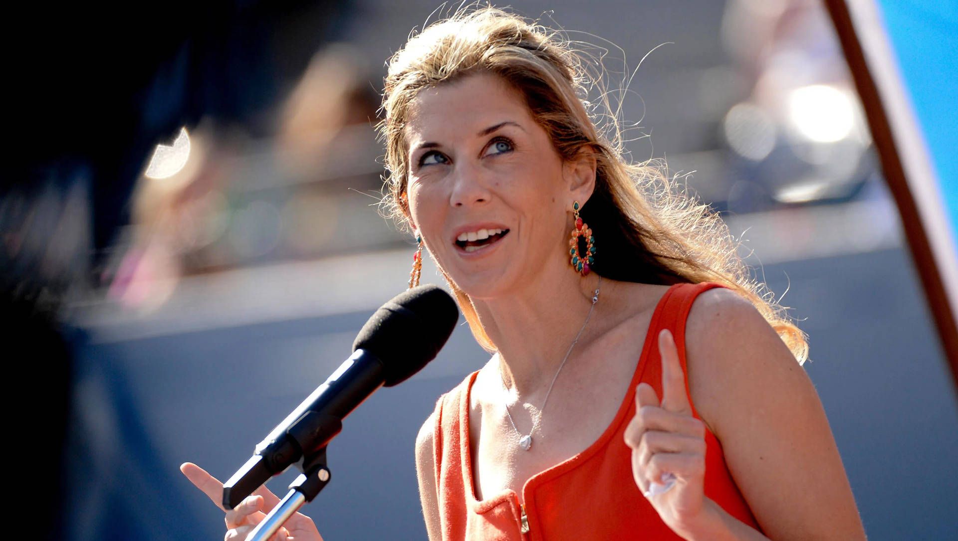 Monica Seles Wearing Colorful Dangling Earrings Background