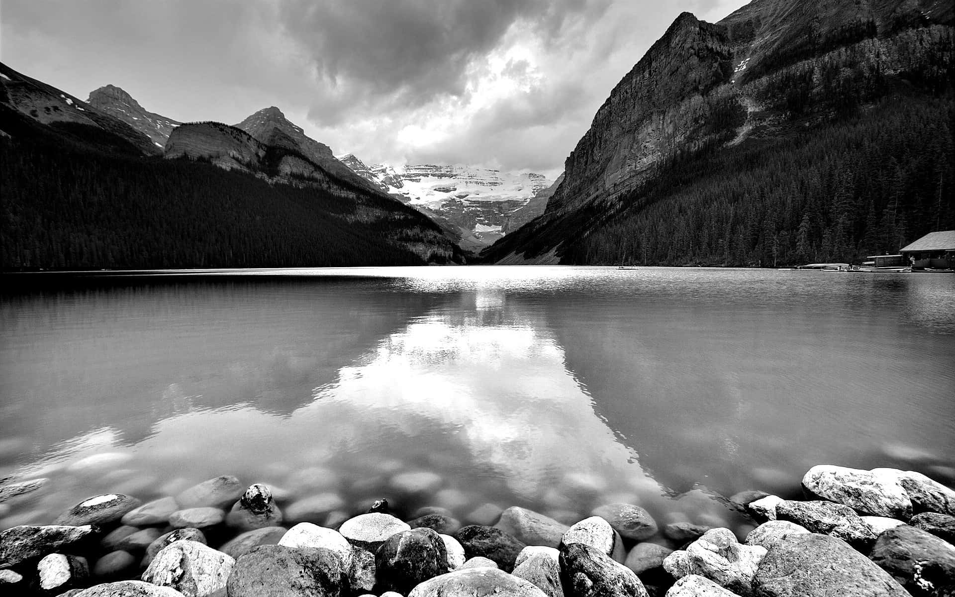 Monochrome Mountain Lake With Rocks Background
