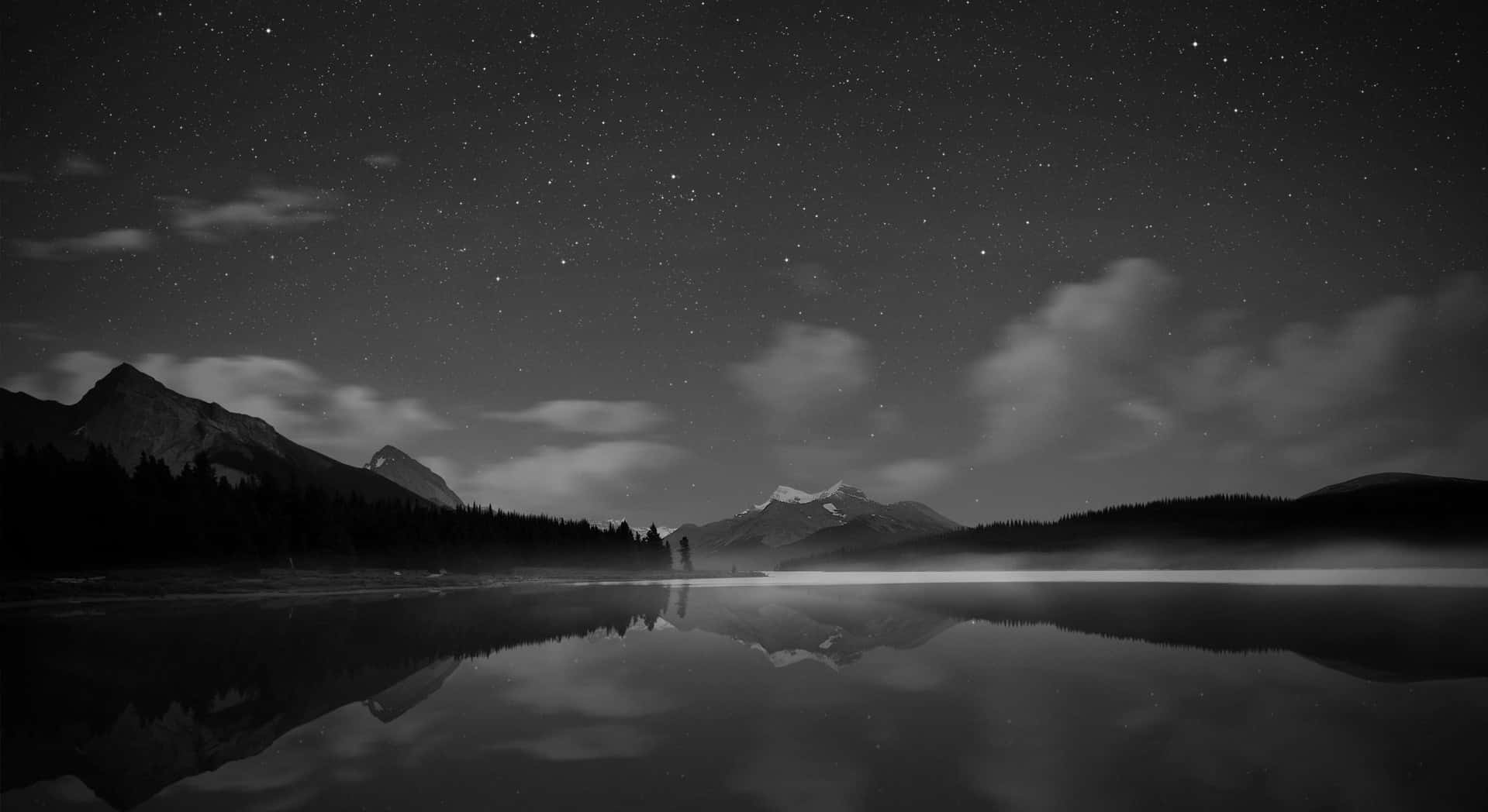 Monochrome Mountains With Calm Lake Background