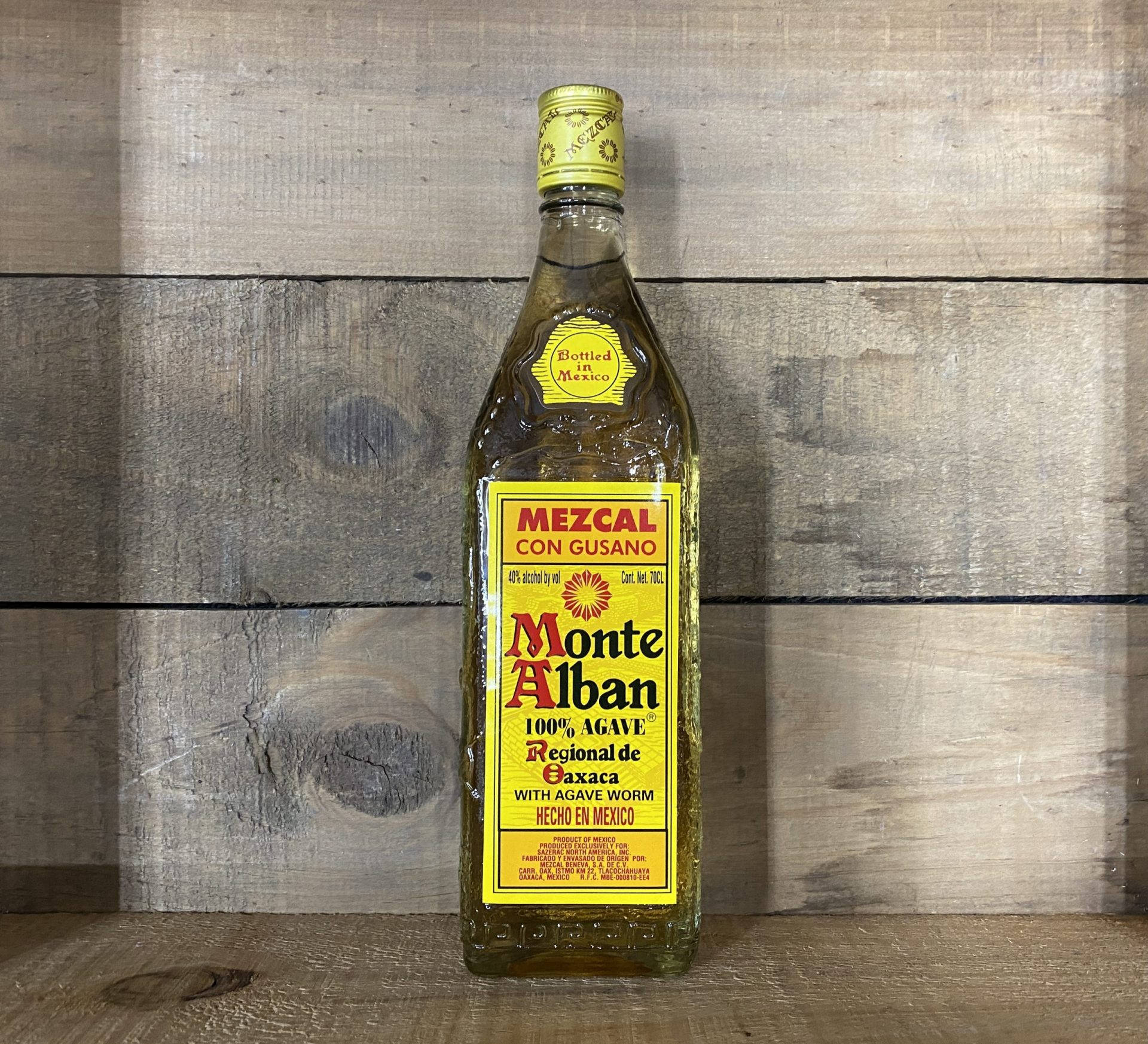 Monte Alban Mezcal Tequila Beside Wooden Wall Background