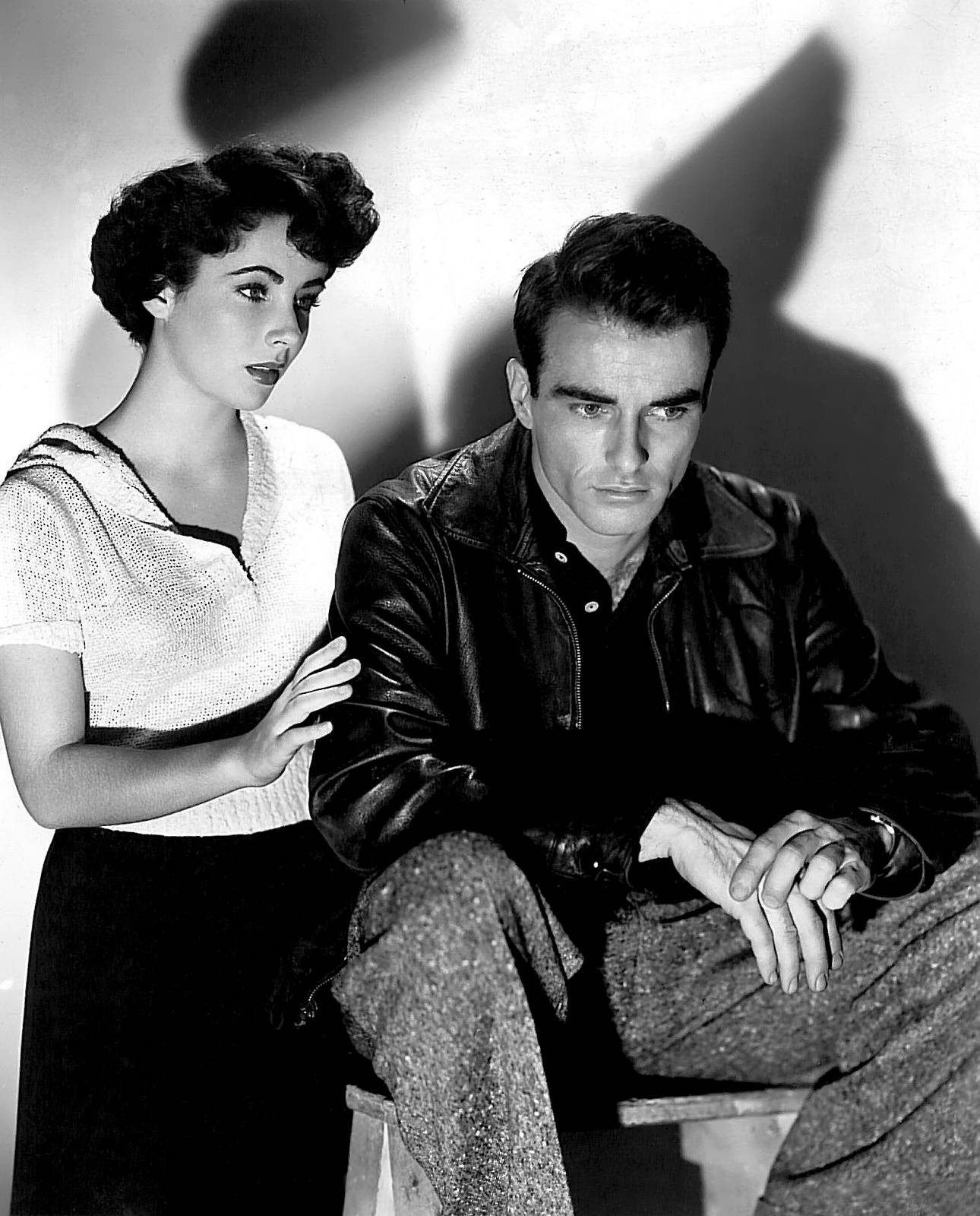 Montgomery Clift And Elizabeth Taylor In A Classic Hollywood Moment Background