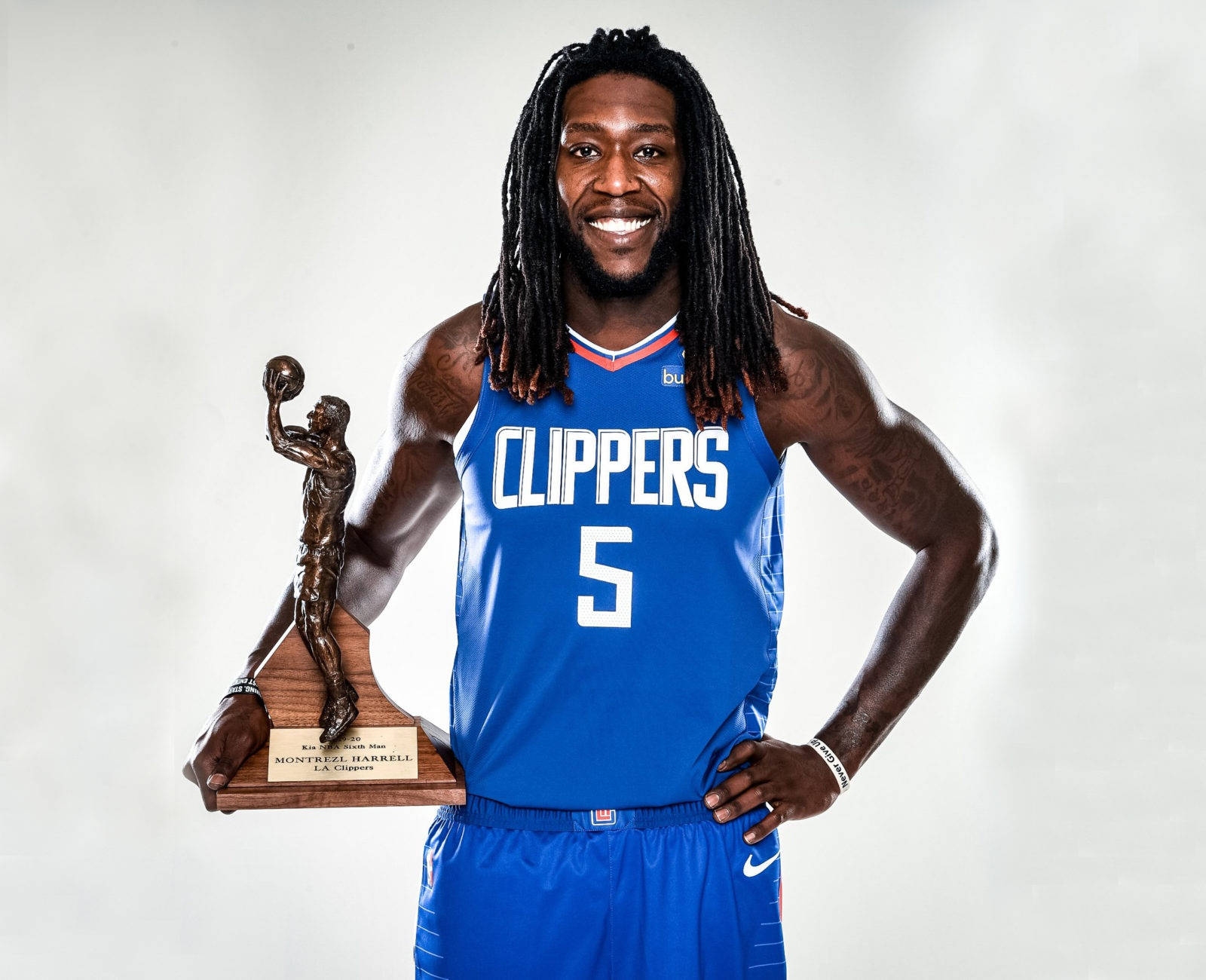 Montrezl Harrell Of Los Angeles Clippers Holding A Trophy Background