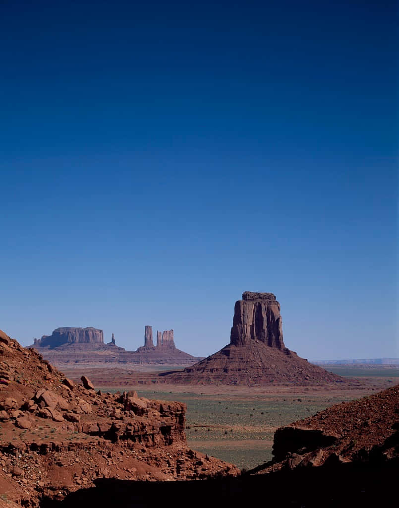 Monument Valley Navajo Tribal Park Buttes And Hughes Background