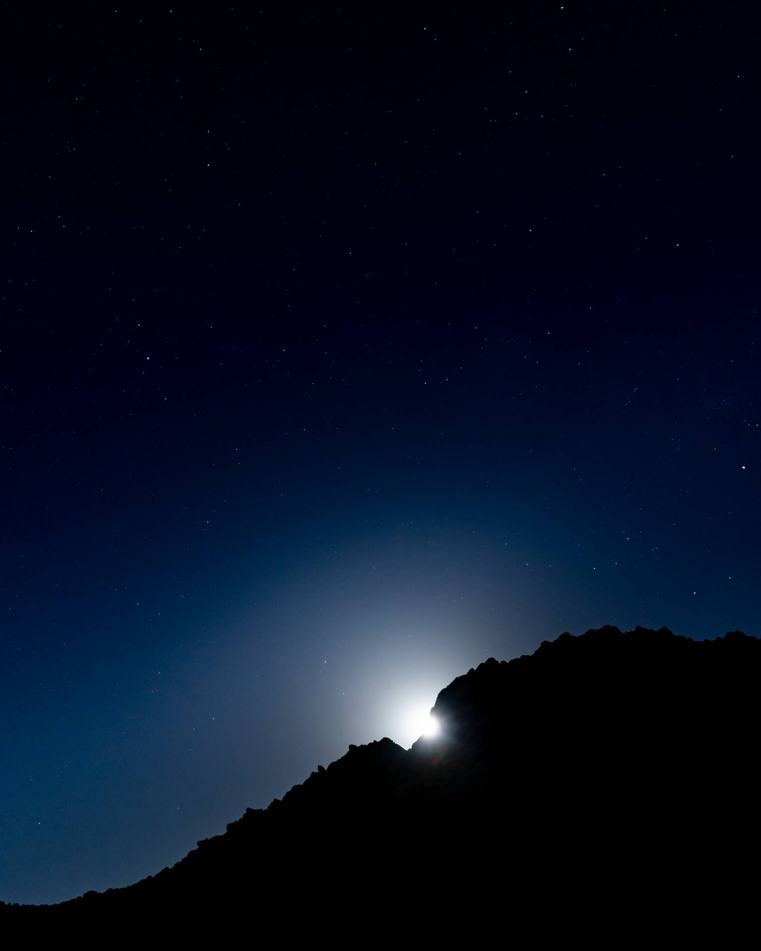 Moonlight Behind Mountain Silhouette