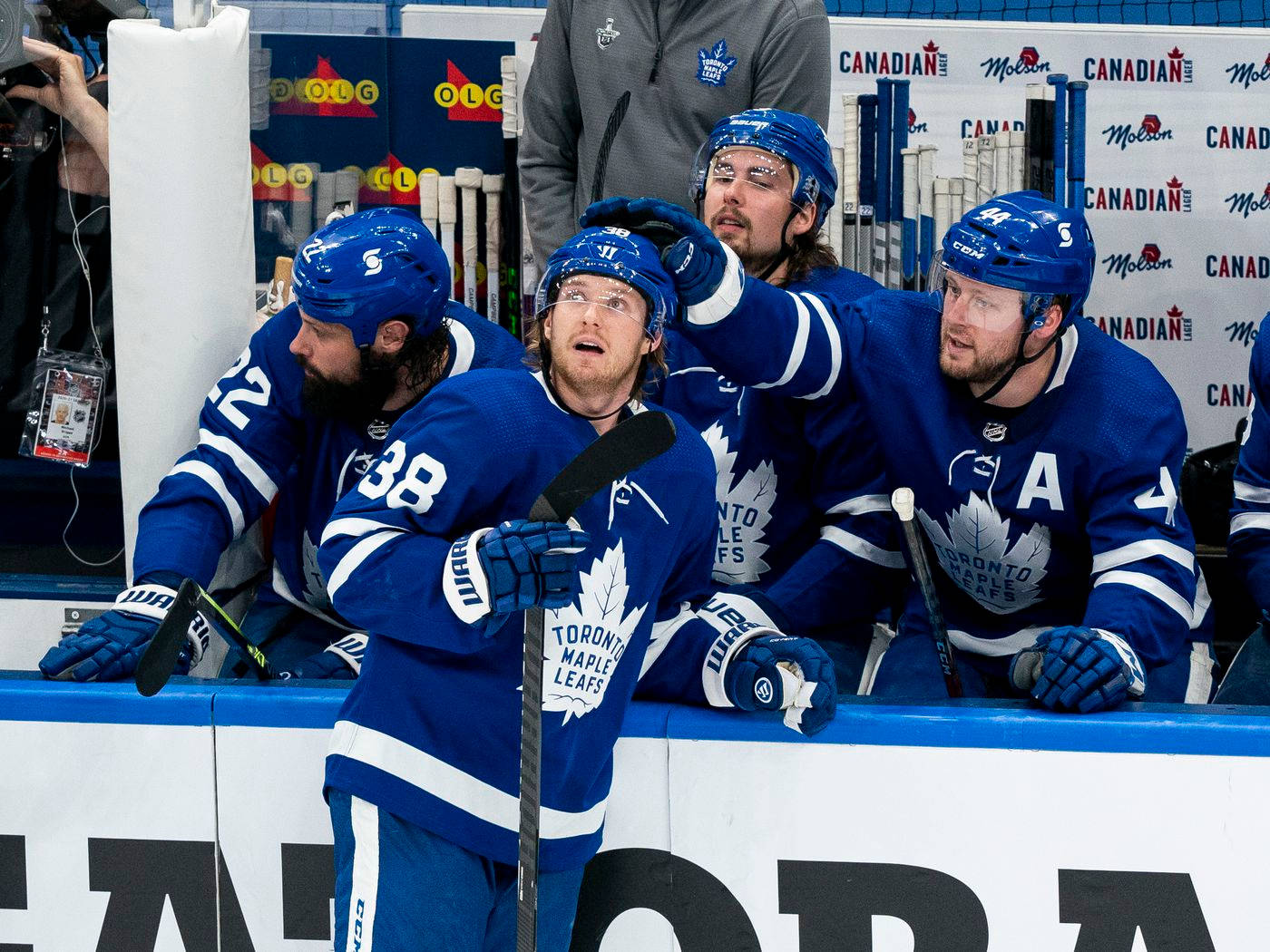 Morgan Rielly And Rasmus Sandin On The Ice Background