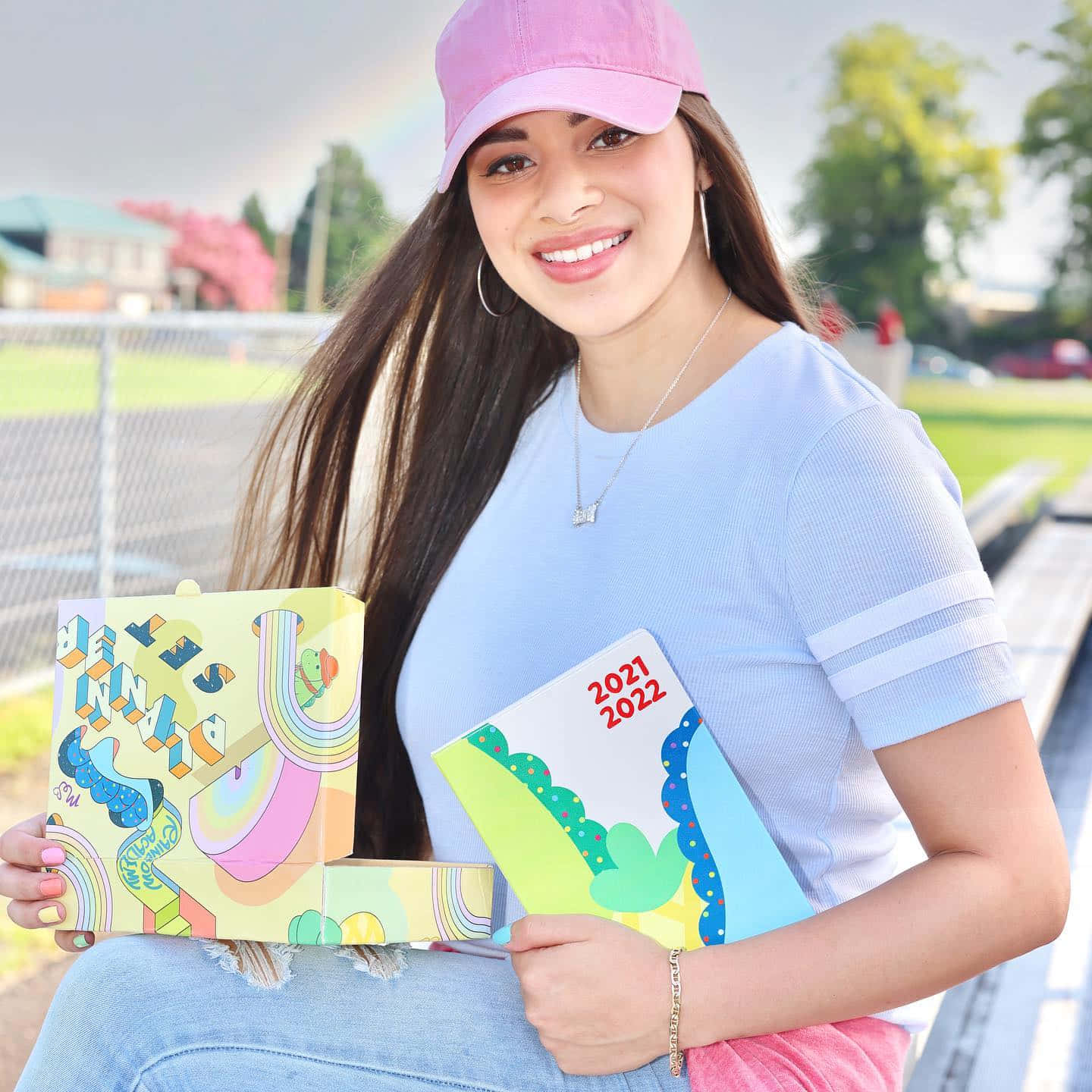 Moriah Elizabeth Holding Art Books Background