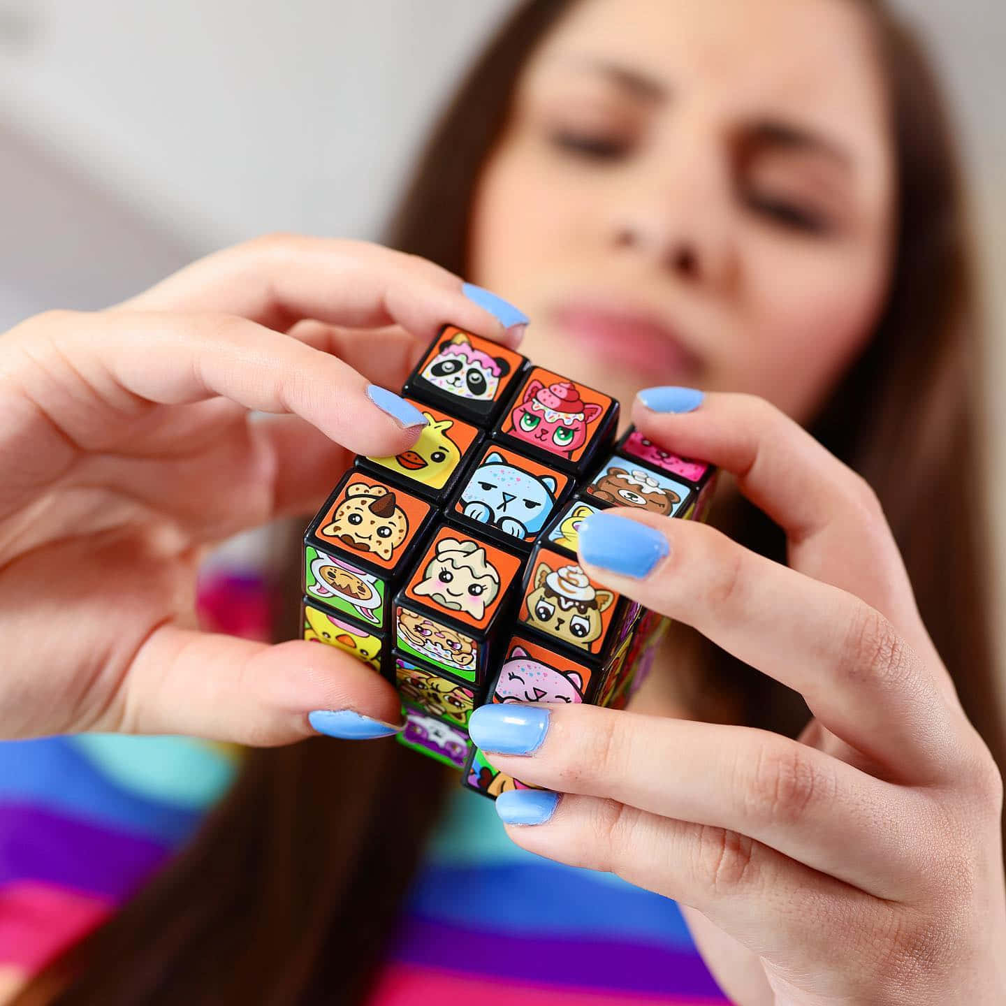 Moriah Elizabeth Holding Rubik's Cube Background