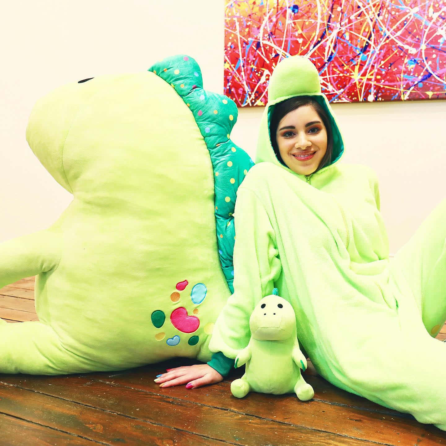 Moriah Elizabeth In Dinosaur Onesie Background