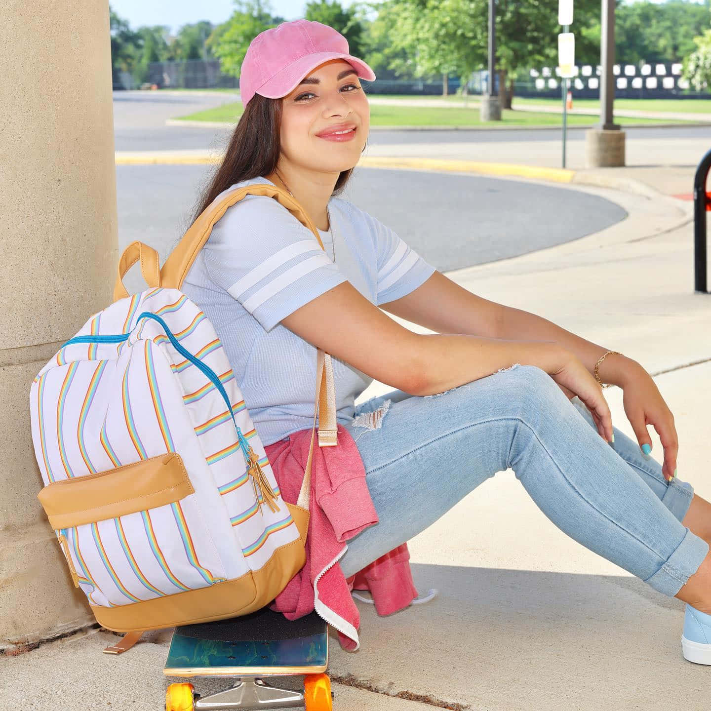 Moriah Elizabeth Sitting On Skateboard Background