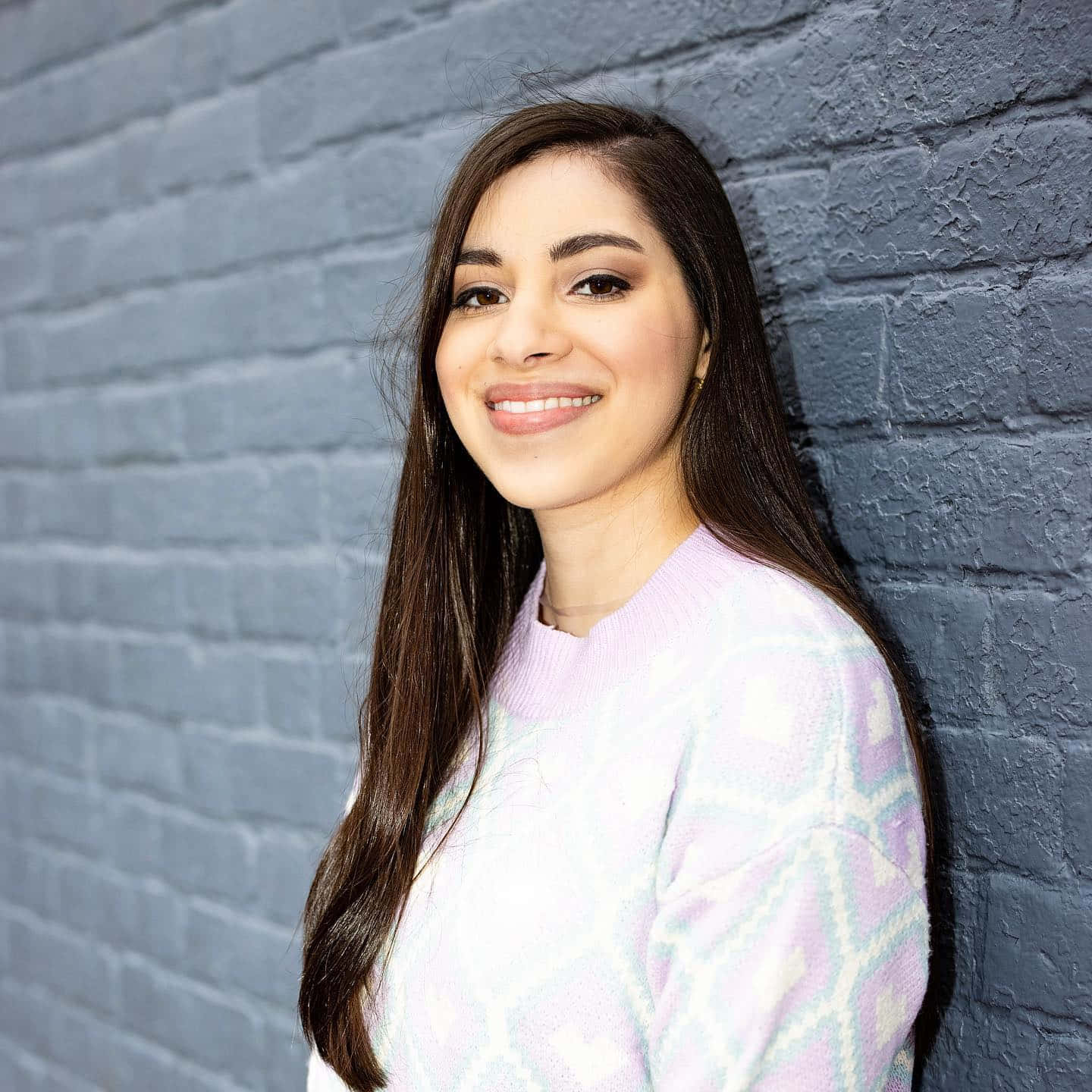 Moriah Elizabeth Smiling In Pink Background