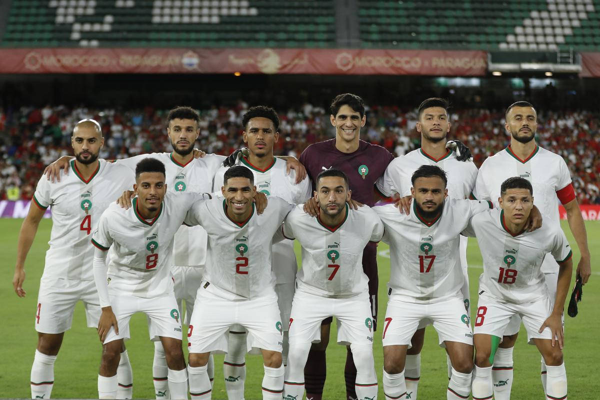 Morocco National Football Team In White Jerseys Background