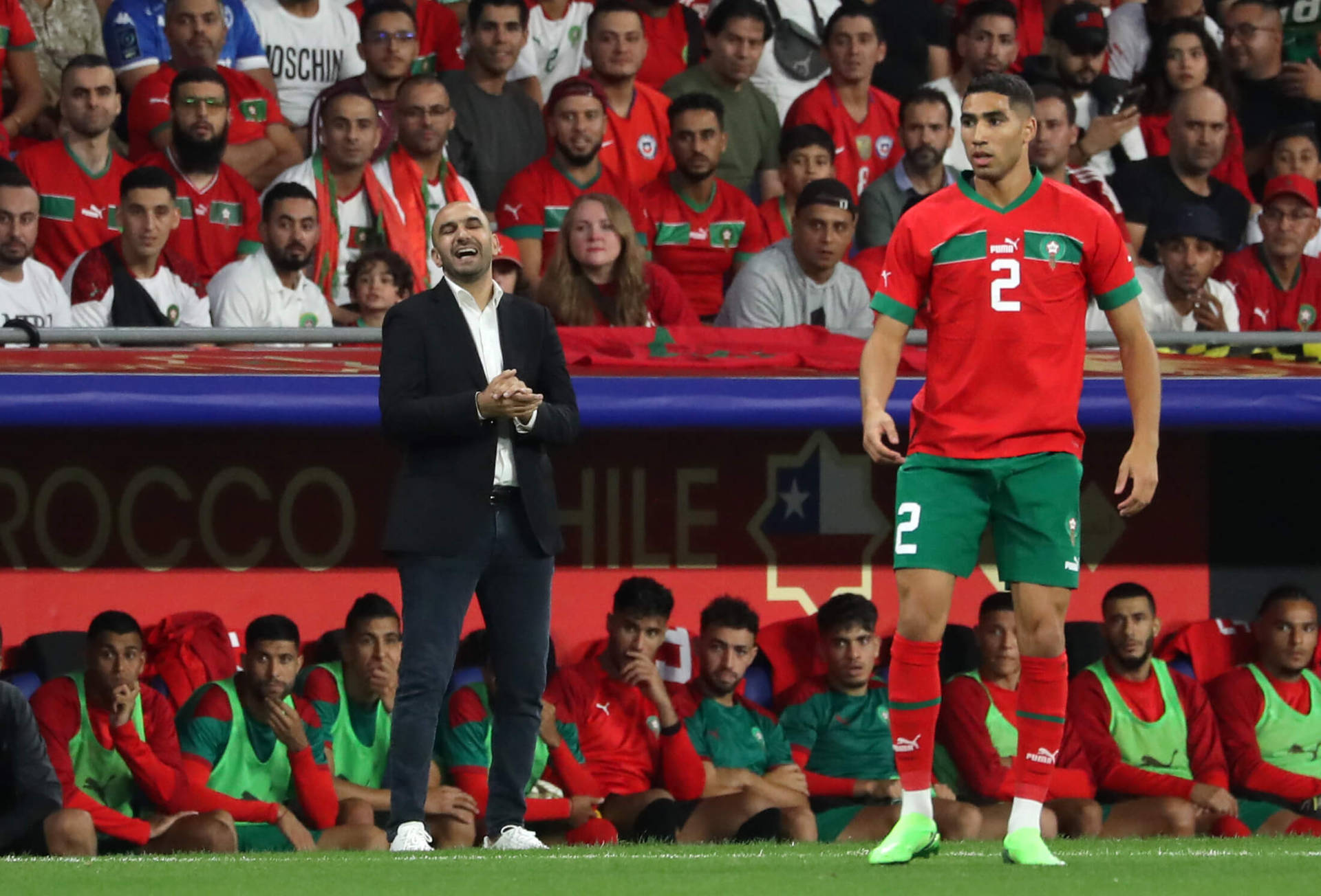 Morocco National Football Team Player With Man In Suit Background