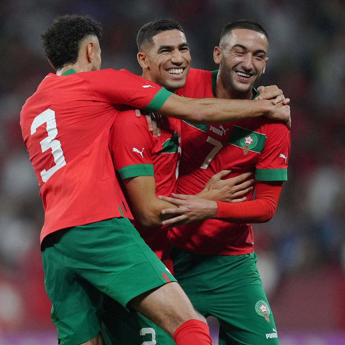 Morocco National Football Team Players Hugging Background