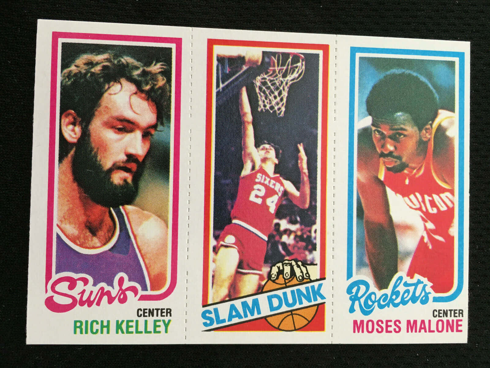 Moses Malone And Rich Kelley In A Heated Basketball Match Background